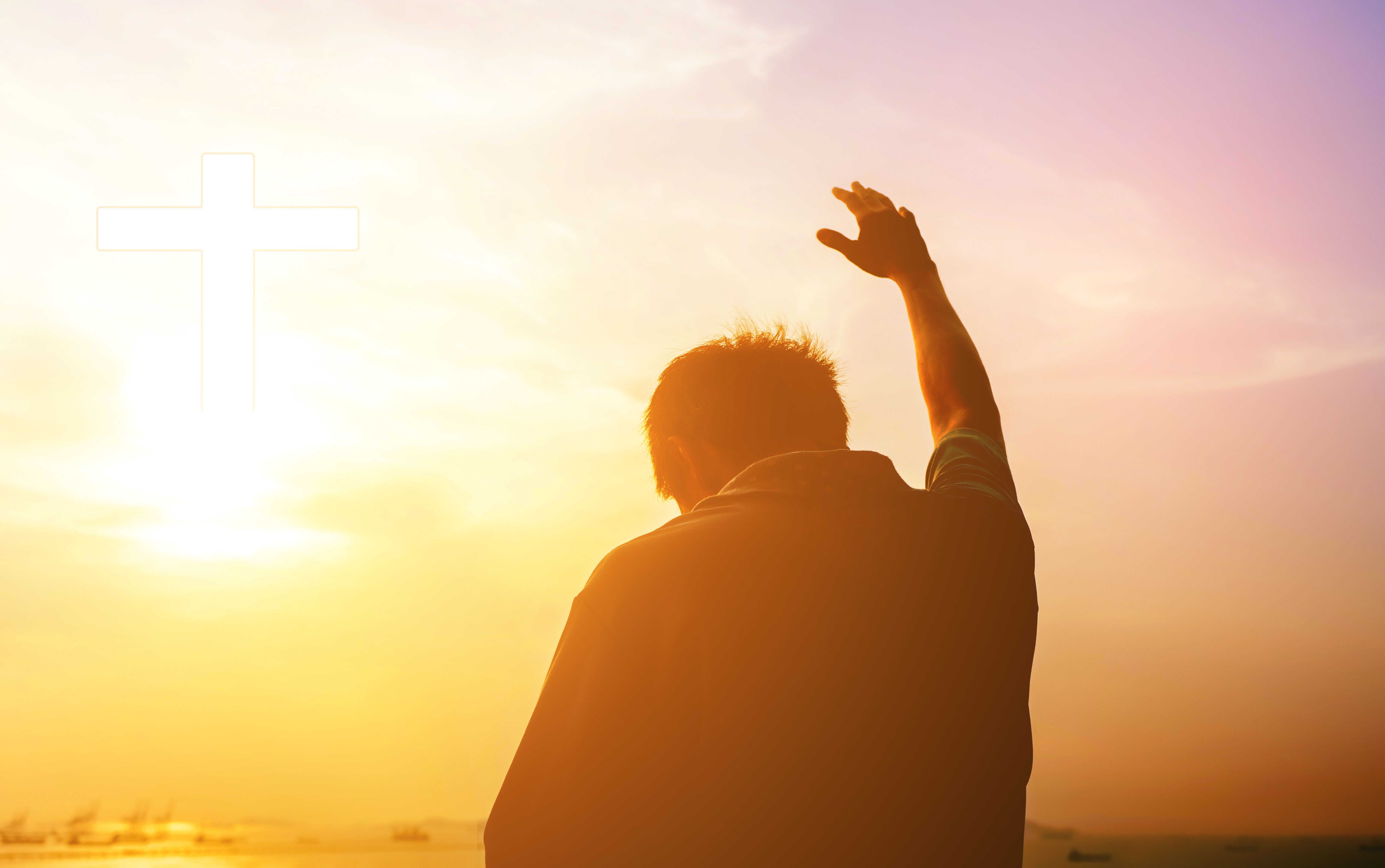 Digital Composite Image Of Silhouette Man With Arm Raised Praying While Standing Against Sky During Sunset Digital Composite Image Of Silhouette Man With Arm Raised Praying While Standing Against Sky During Sunset