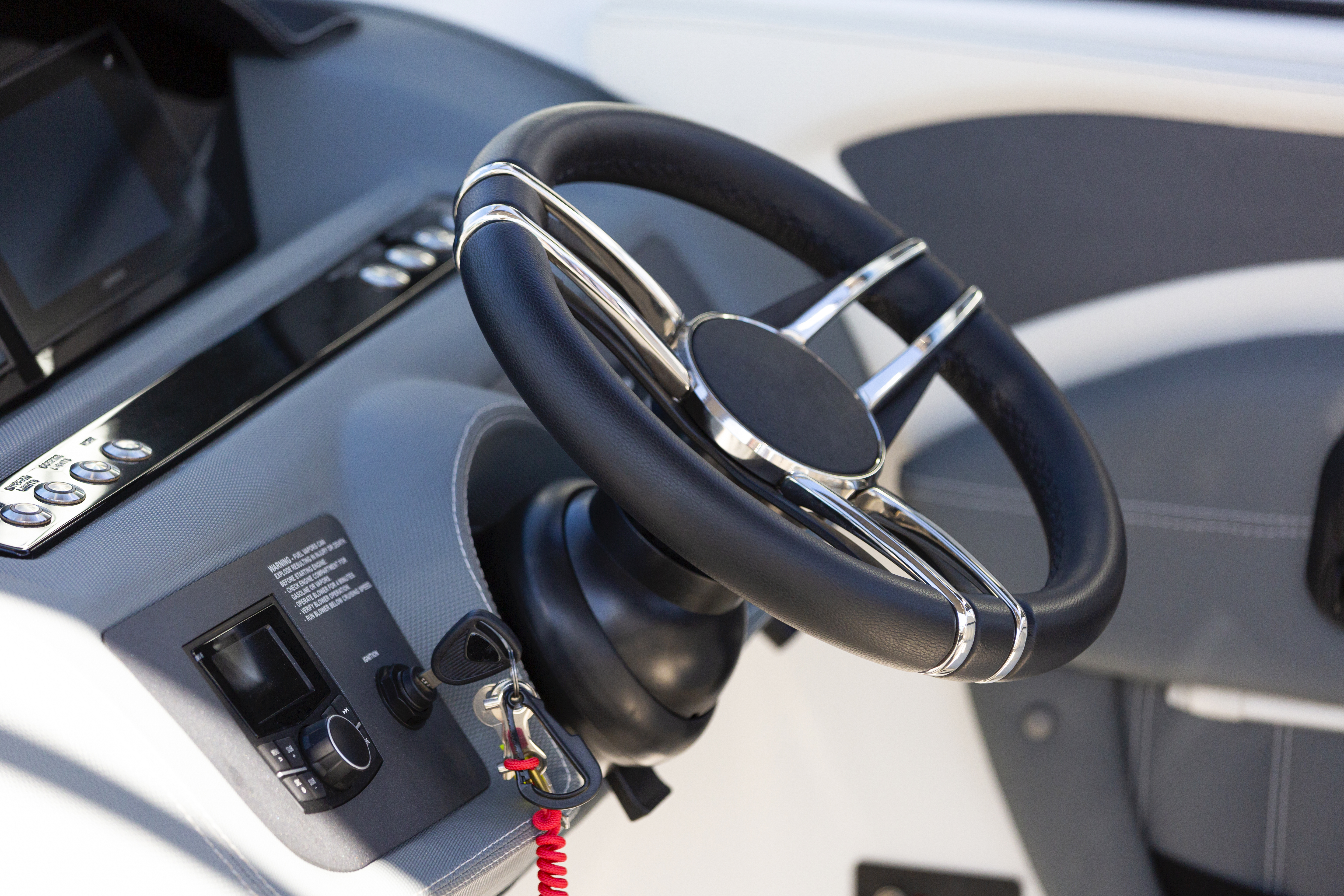 Luxury speedboat steering wheel and control panel, copy space
