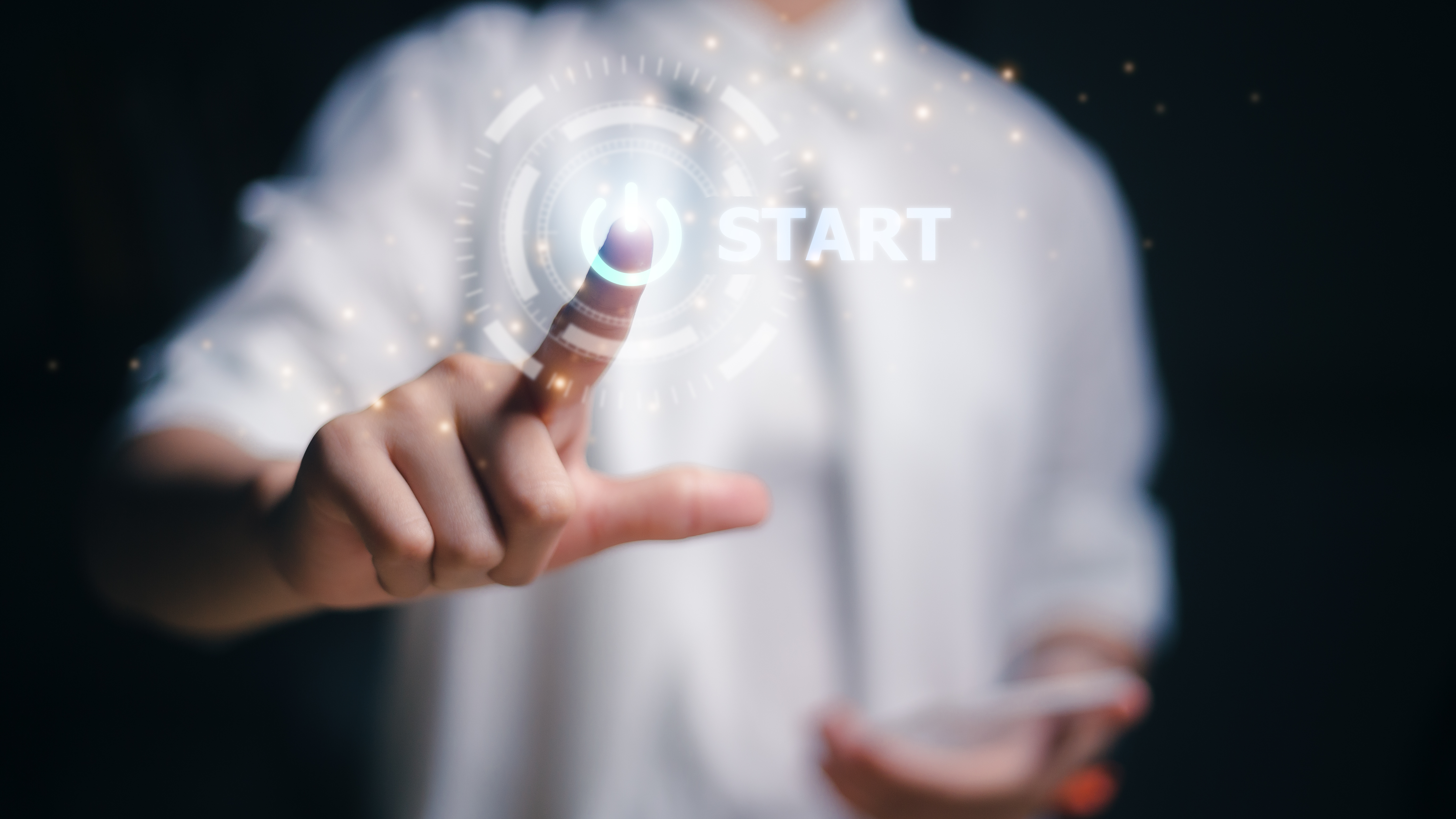 Women hand pressing the start button. To make a new start in life, business, education, or career concept.