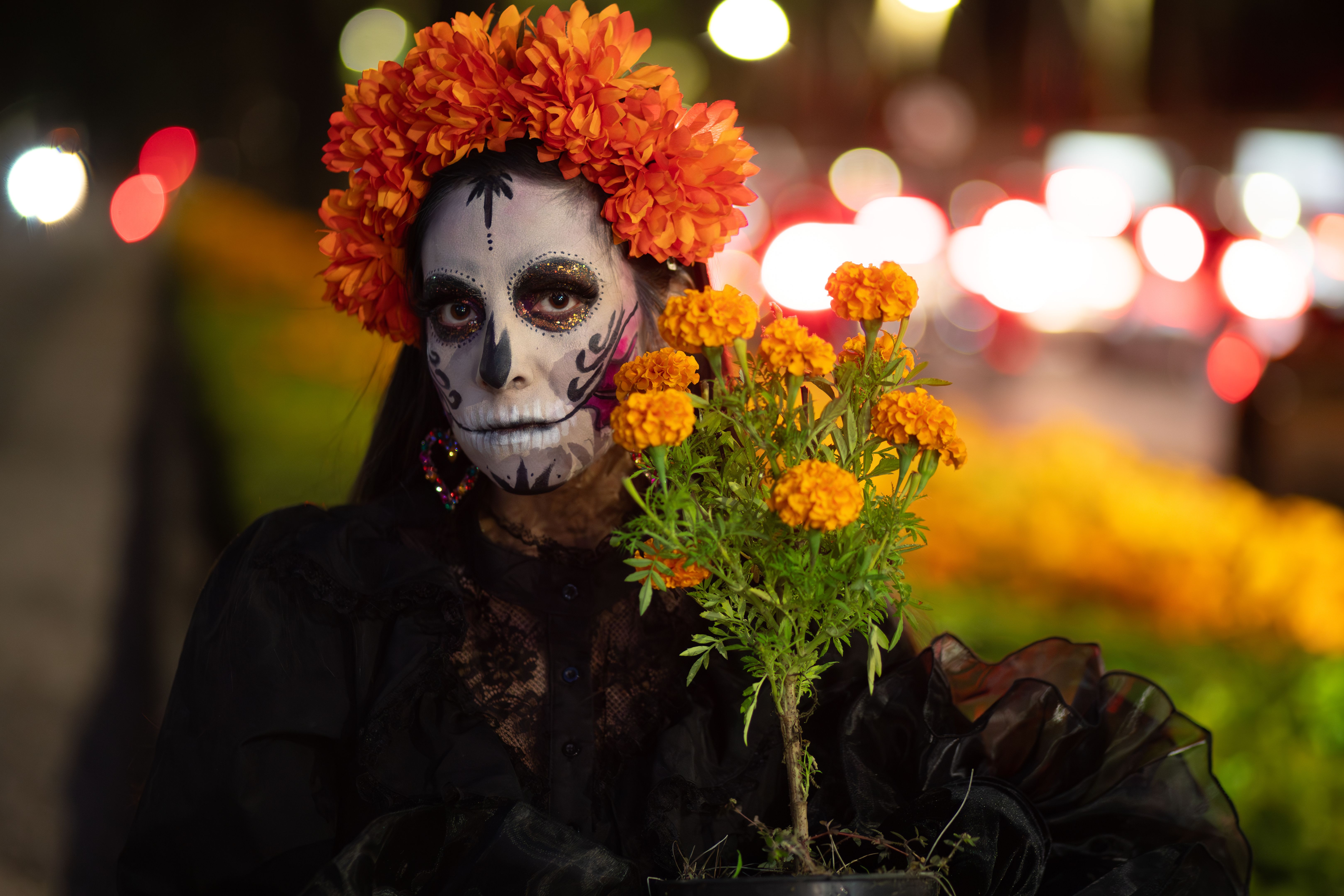 Catrina with Marigold Crown Holding Cempasuchil Blooms