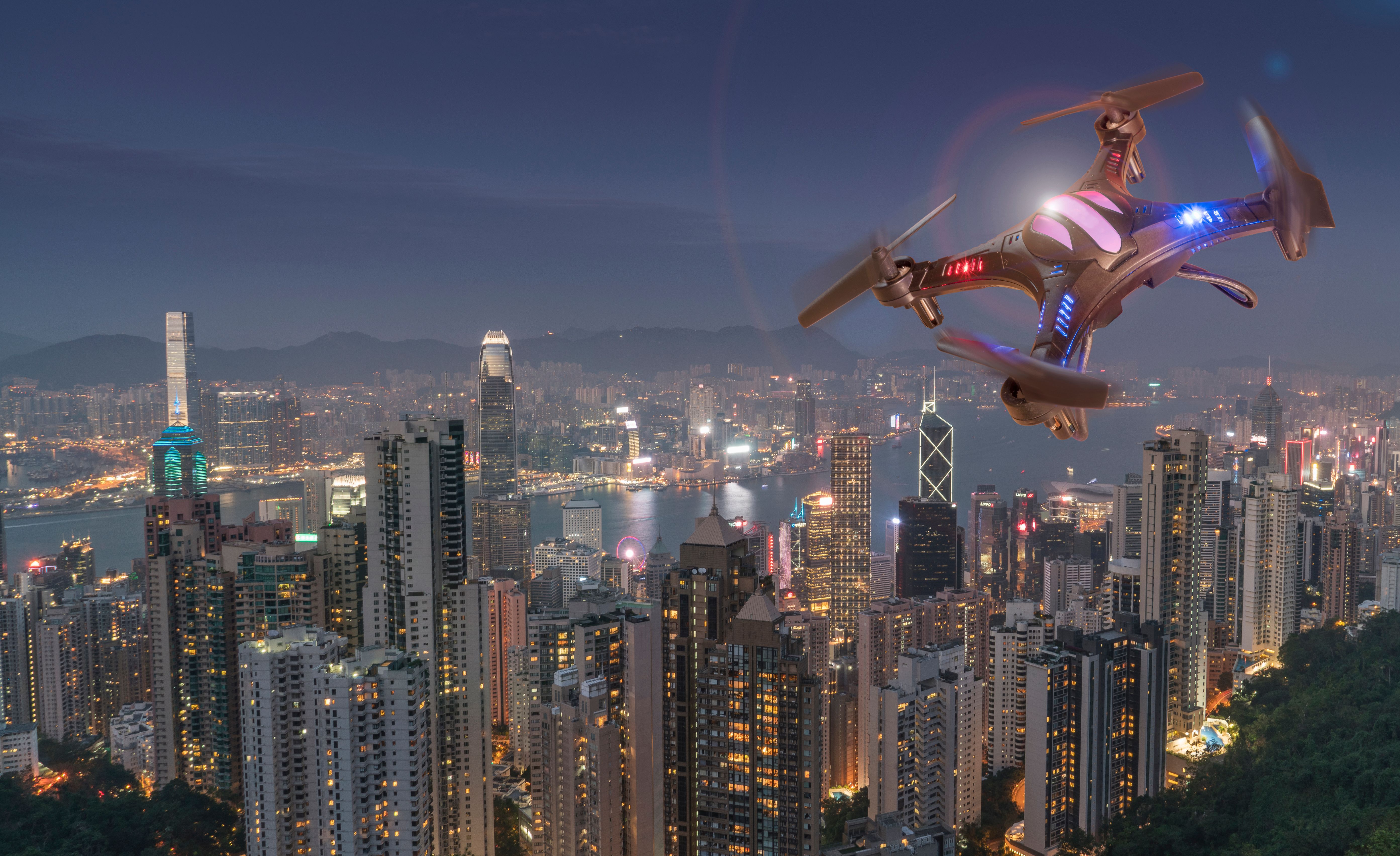 Drone flying over modern city Drone flying over modern city