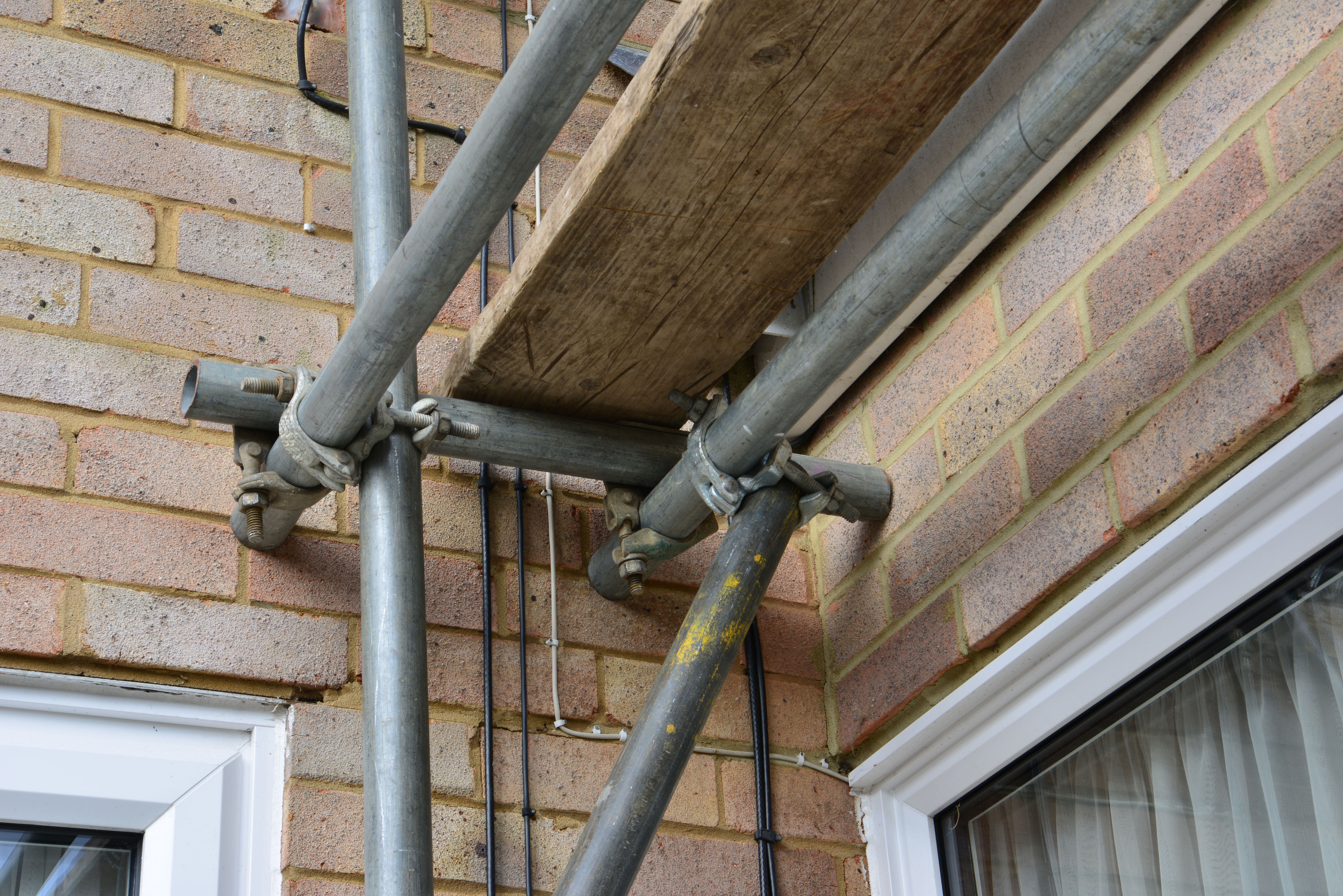 Scaffolding pipe crossing on a Scaffold tower looking up from underneath.