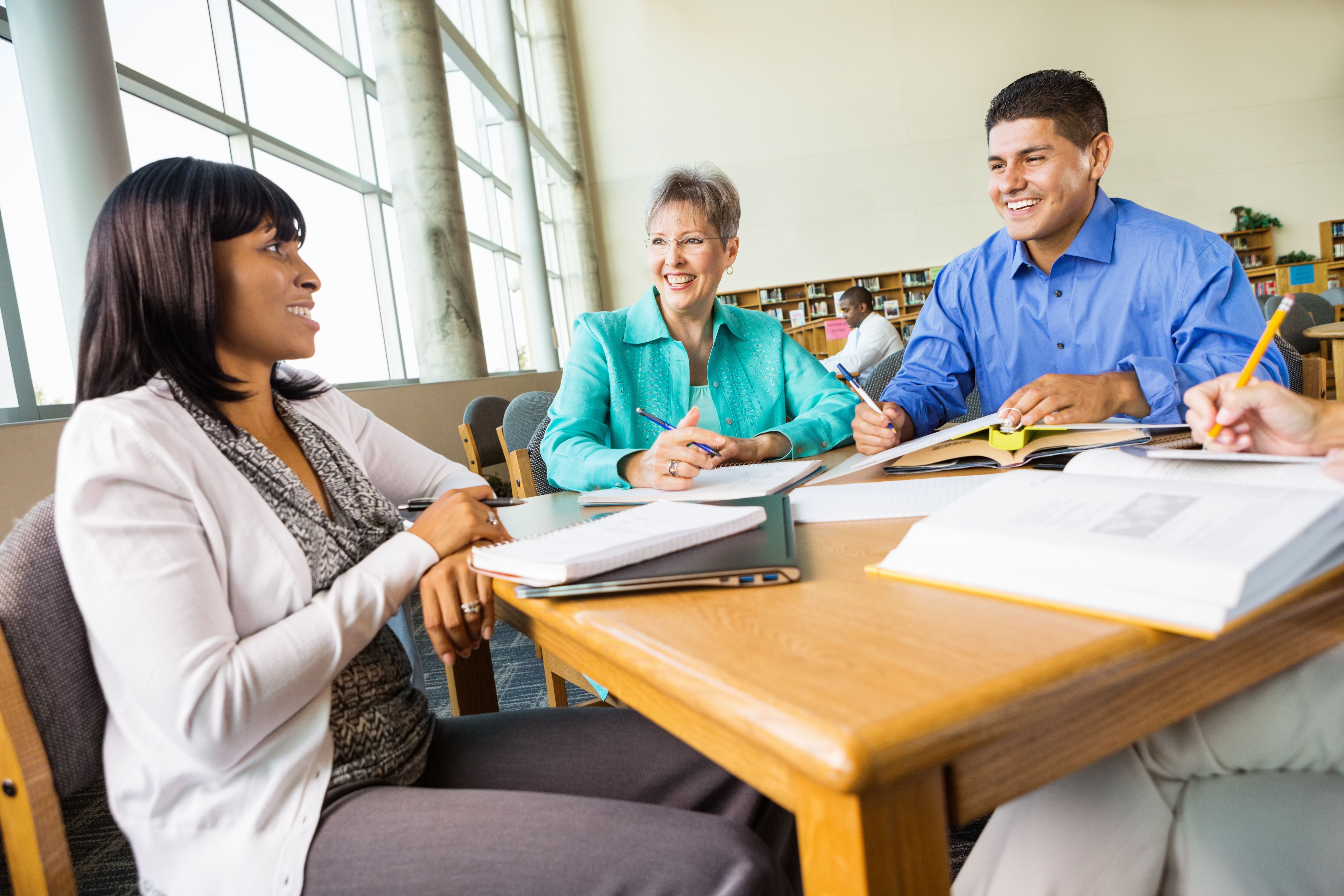 Diverse group of adult students studying for college exam
