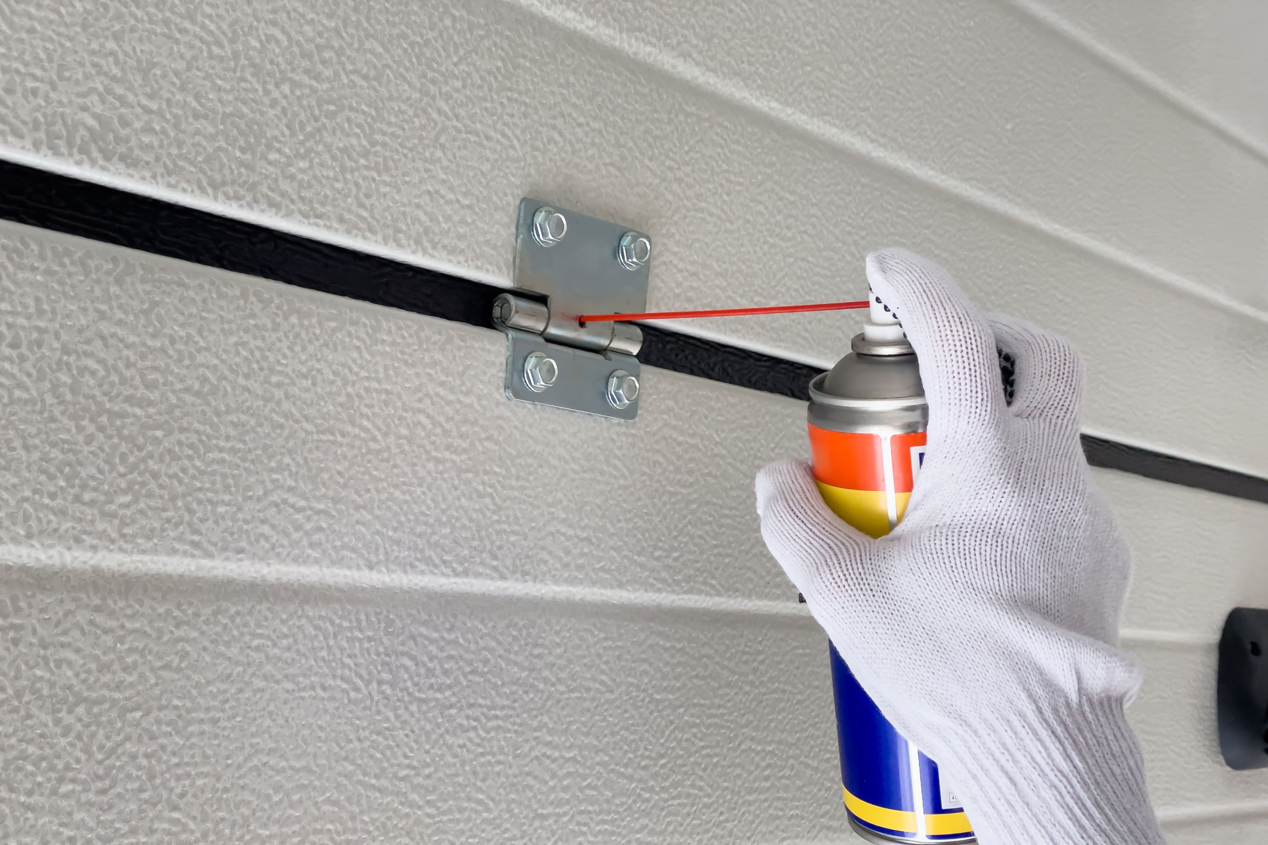 lubricating garage door parts