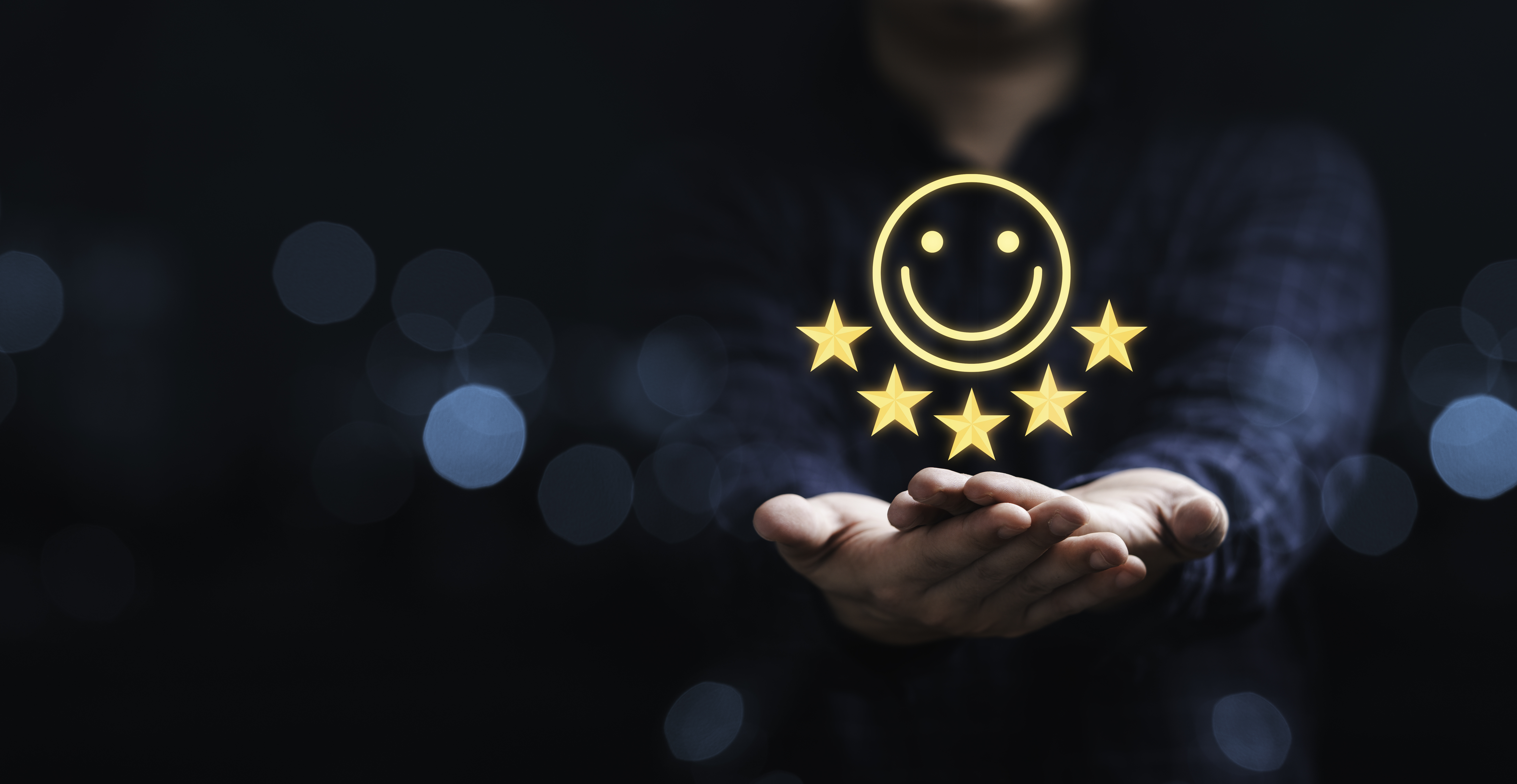 Businessman holding smile icon for the best evaluation , customer satisfaction concept. Businessman holding smile icon for the best evaluation , customer satisfaction concept.