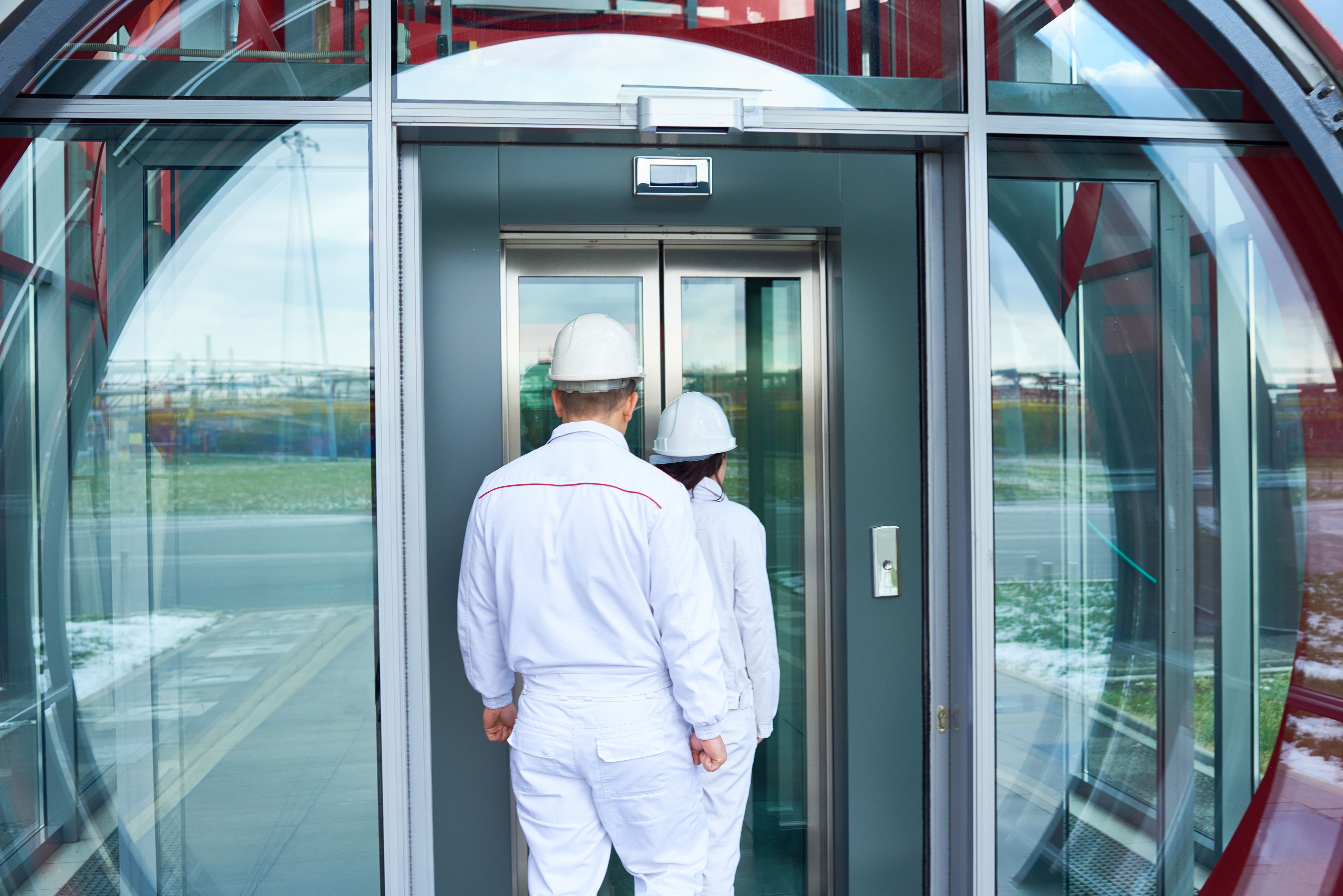 technician inspecting elevator