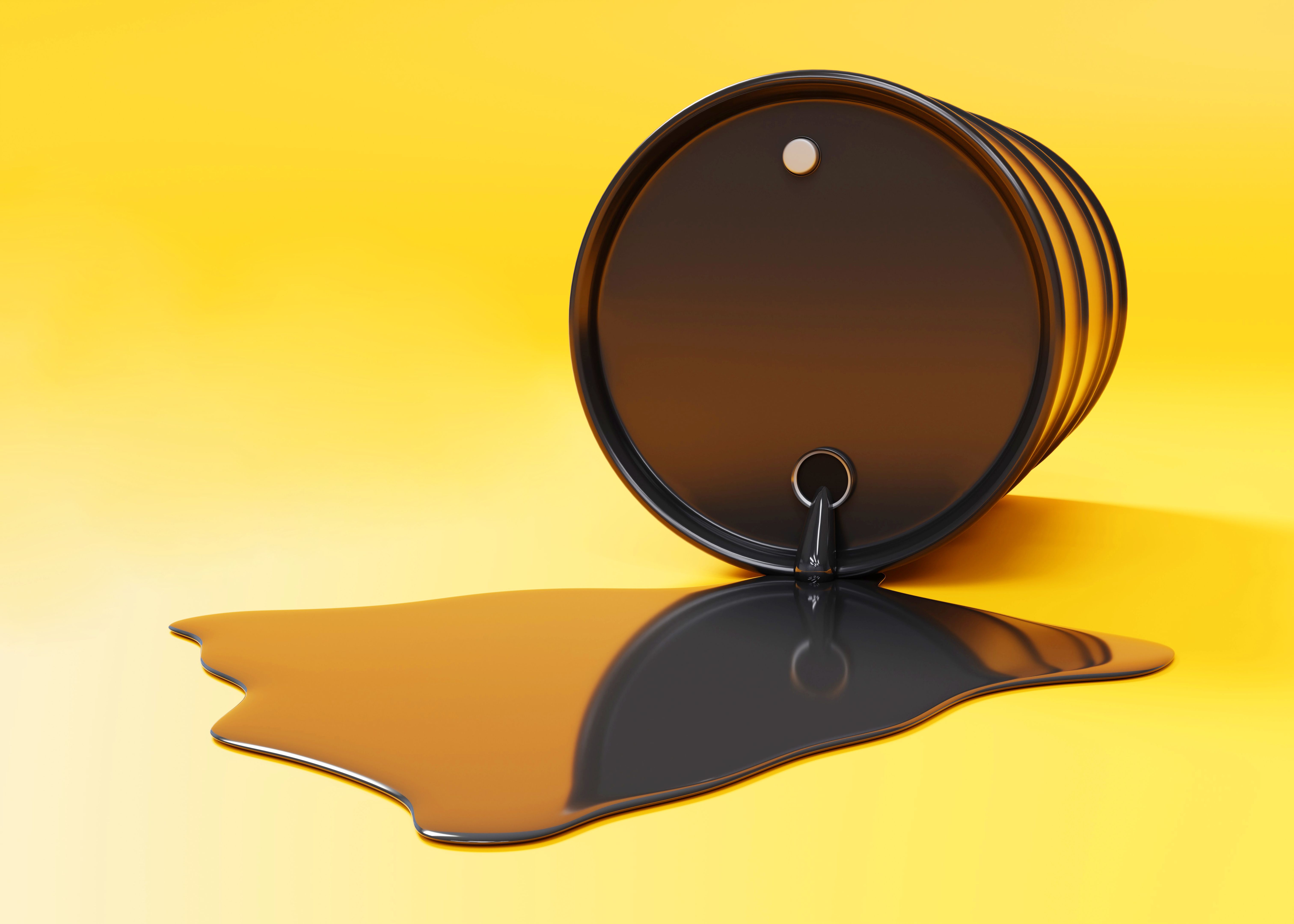 Oil is spilling from the barrel on yellow background