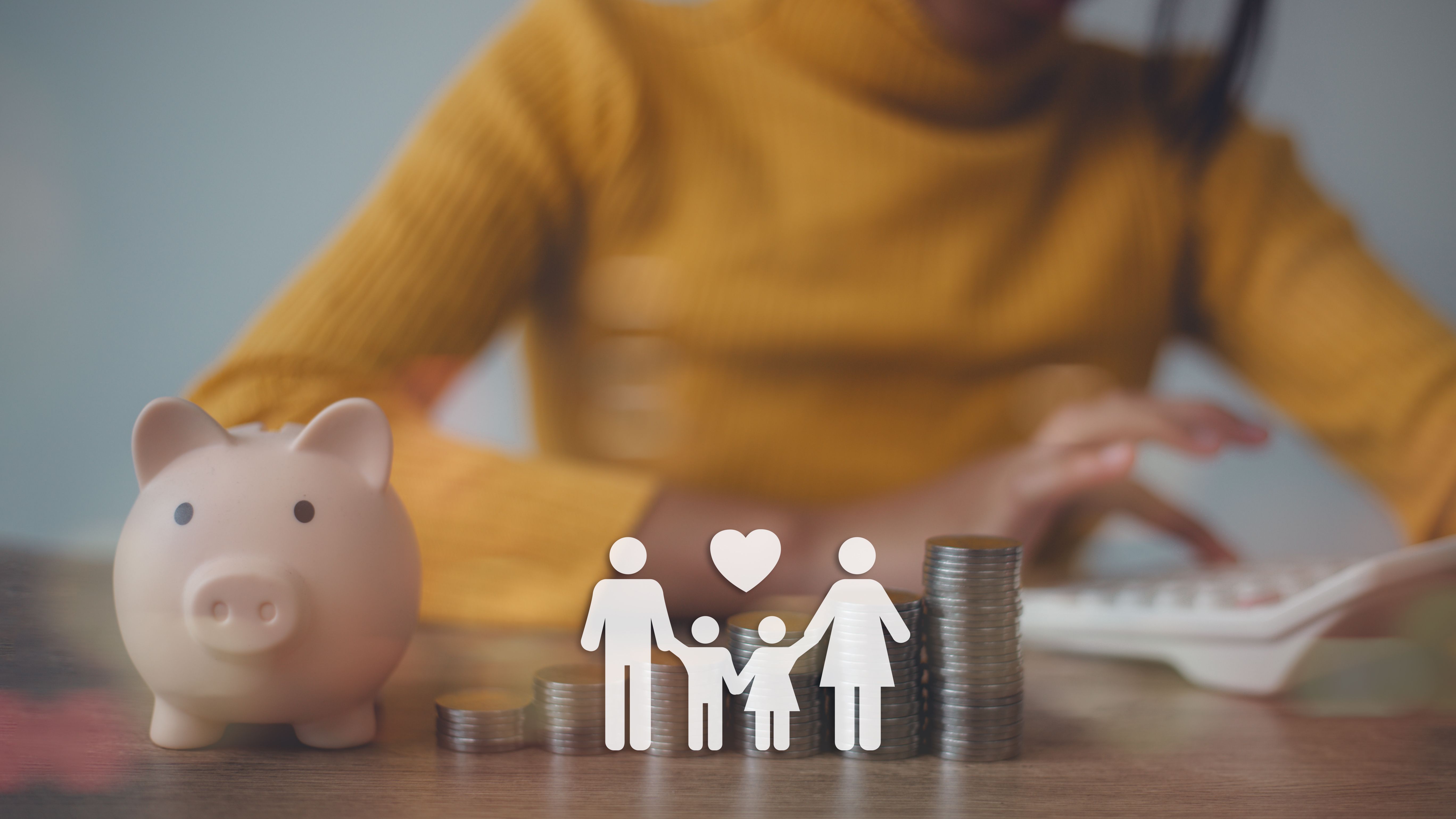 Women calculate money and piggybank and icon family on table, donation, saving, charity, family finance plan concept, fundraising, superannuation, investment, and financial crisis concept.