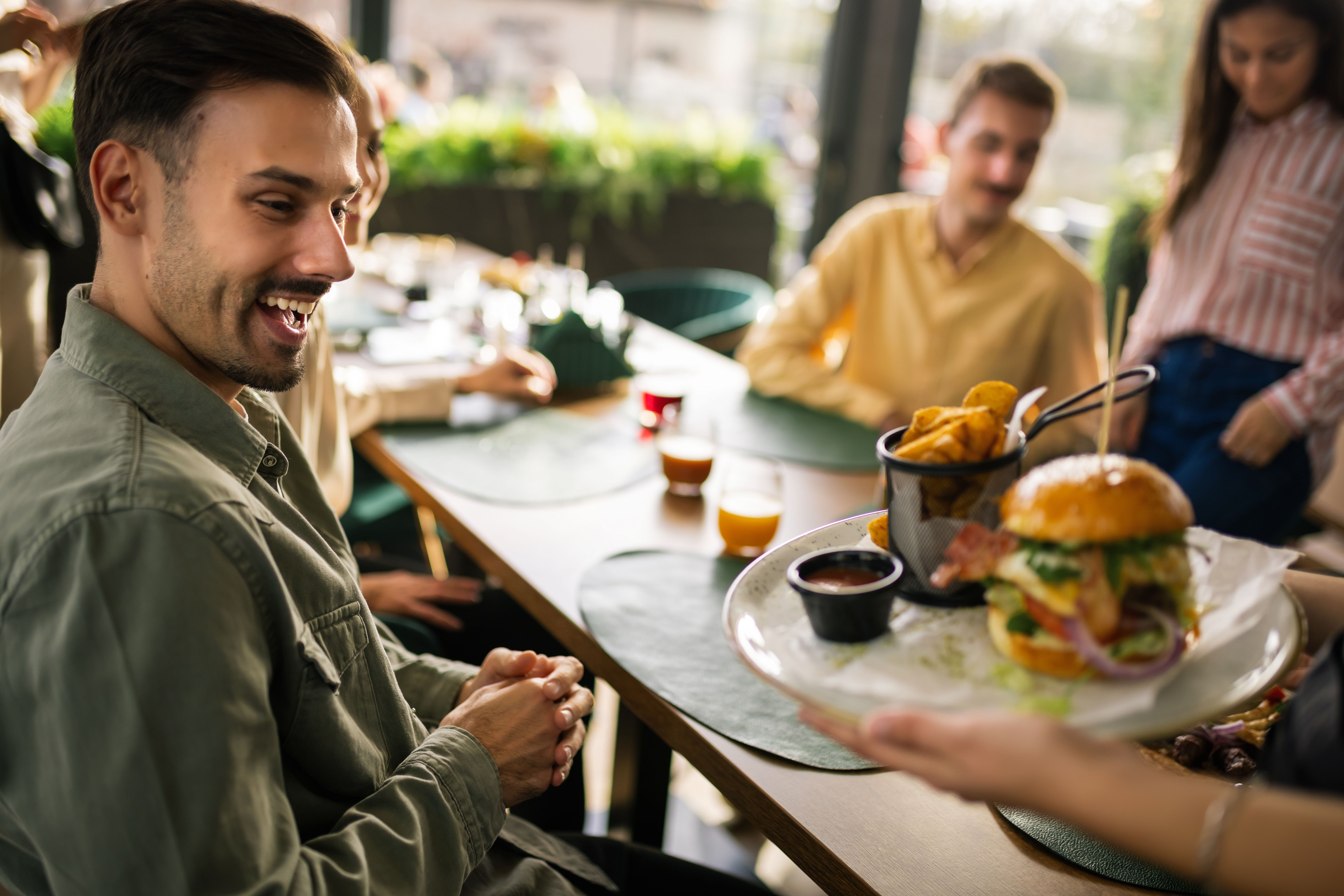 customer enjoying burger