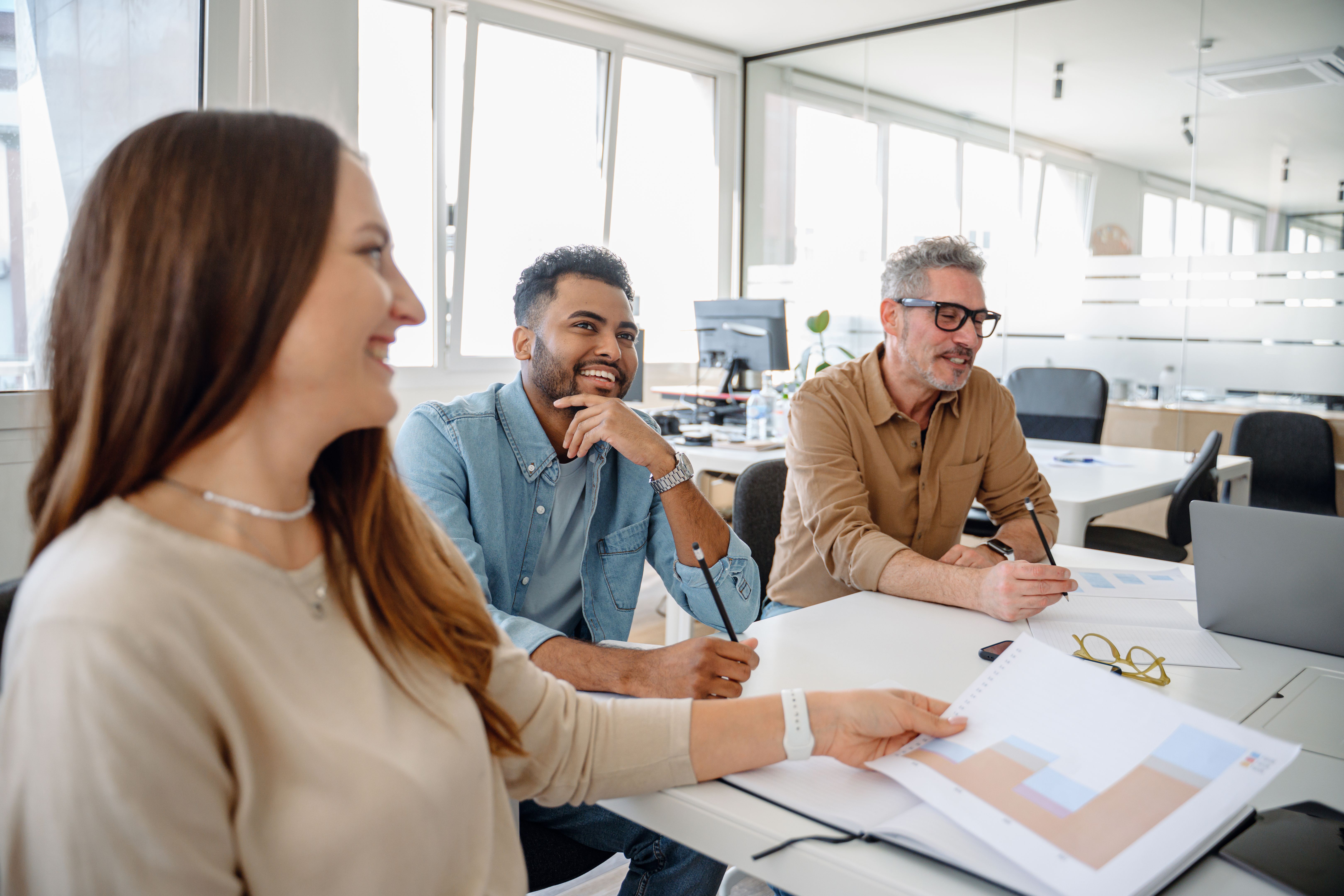 Business professionals actively discussing ideas and strategies during a corporate meeting.