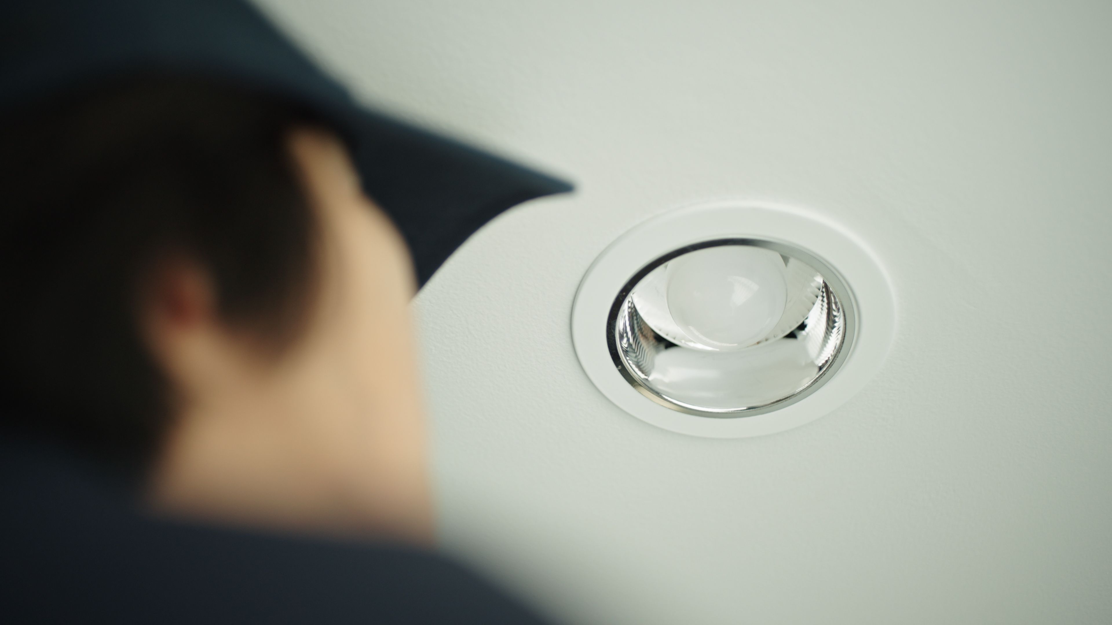 technician inspecting LED