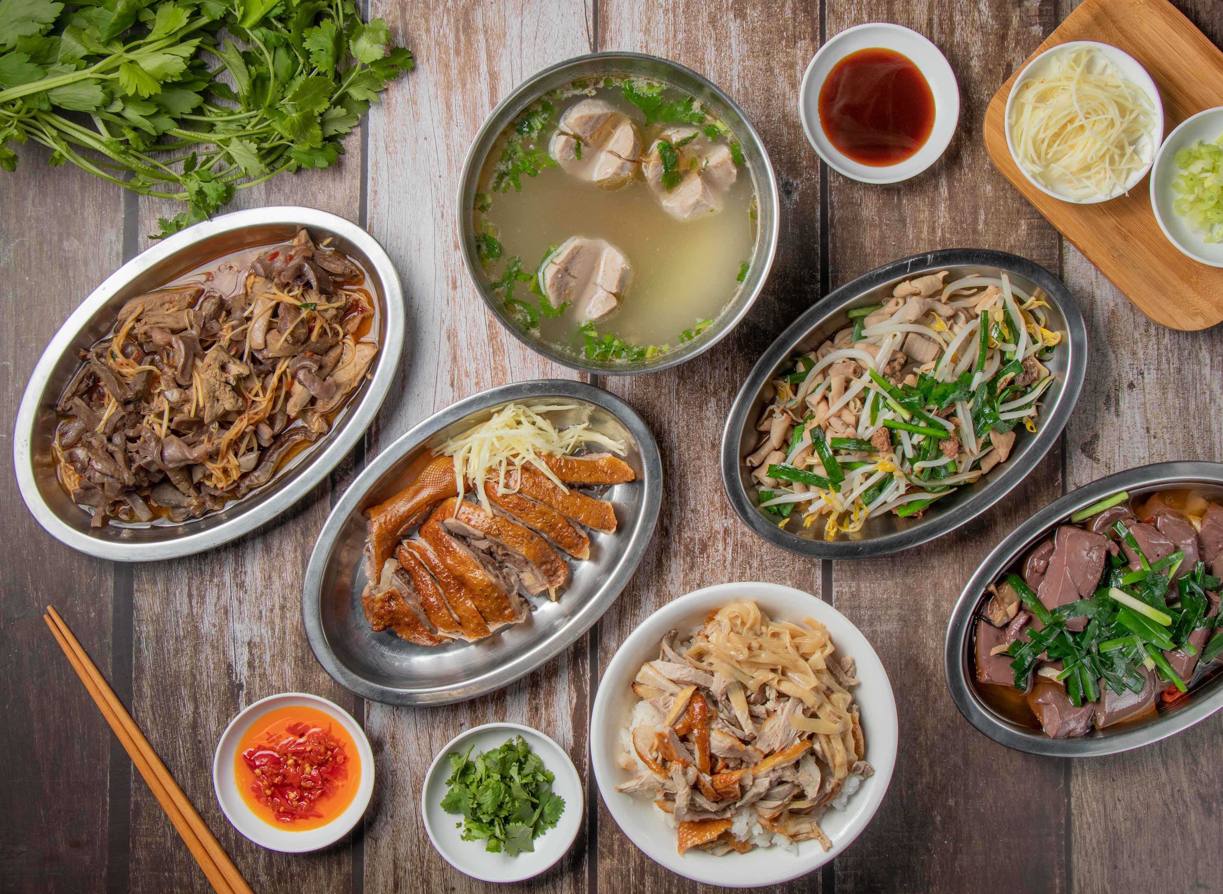 with chilli sauce, noodles, spoon and chopsticks served in dish isolated on napkin top view of hong kong food