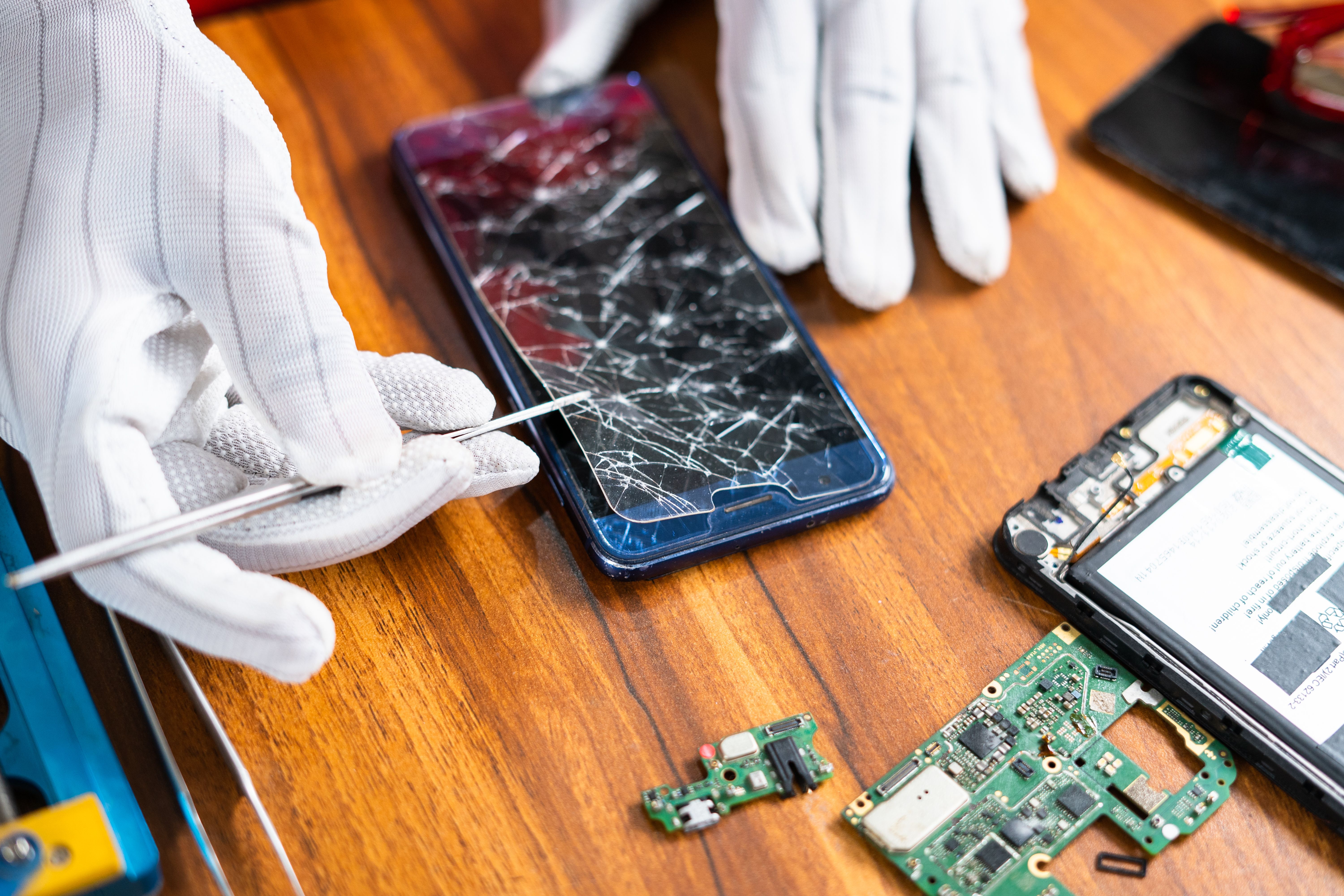 technician repairing phone