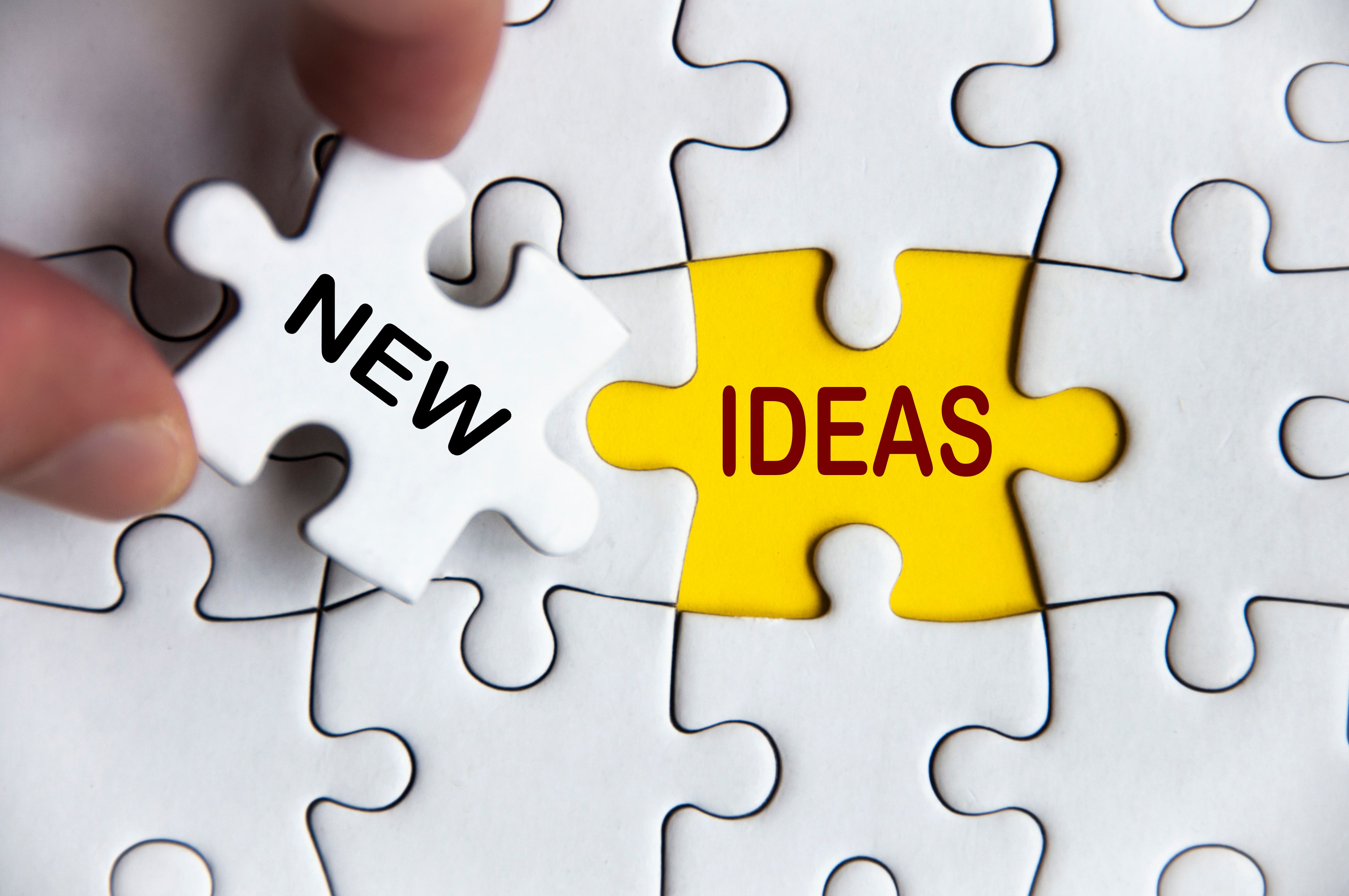 New ideas text on missing jigsaw puzzle. Business idea concept