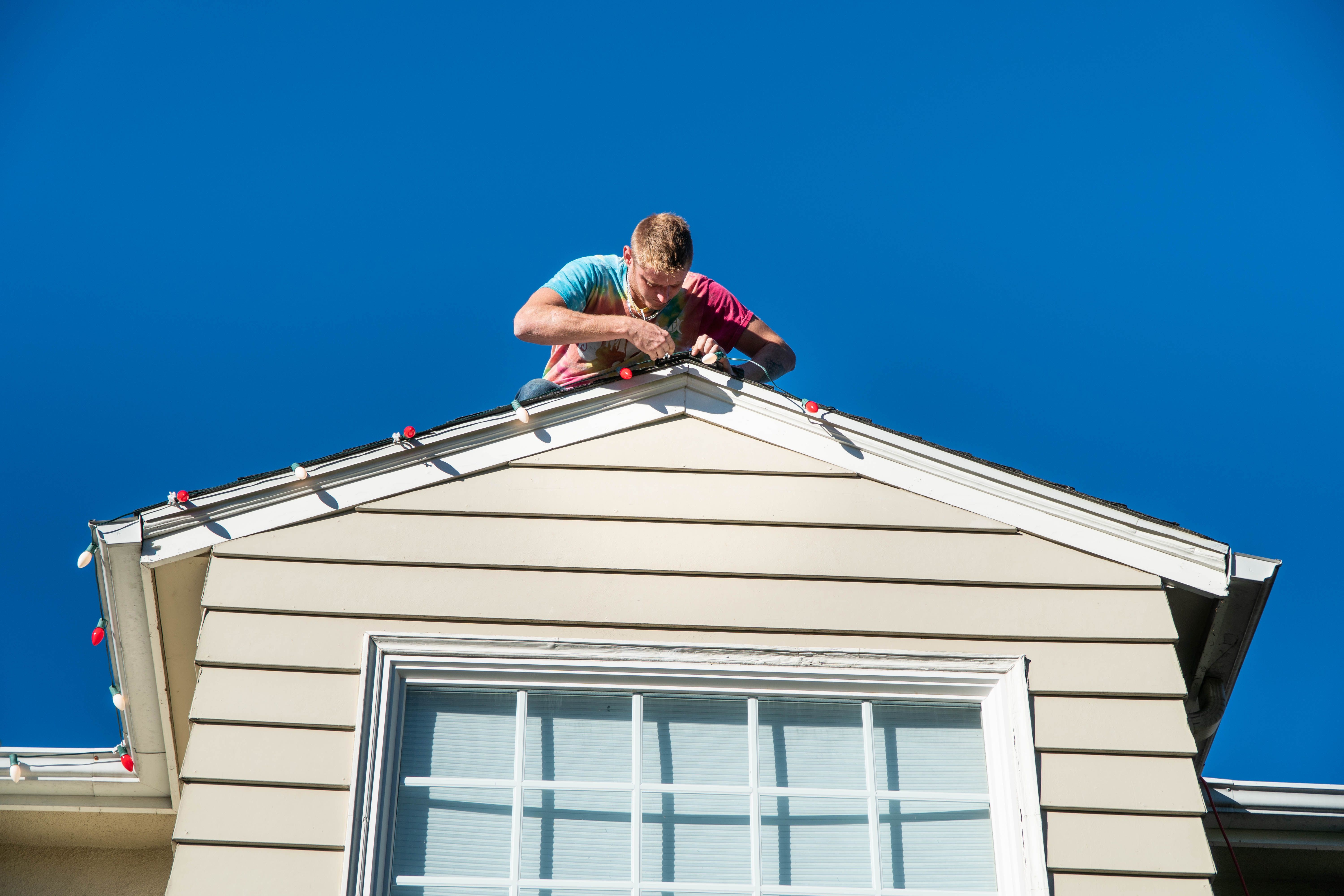 Handyman Installing Christmas Lights Handyman Installing Christmas Lights