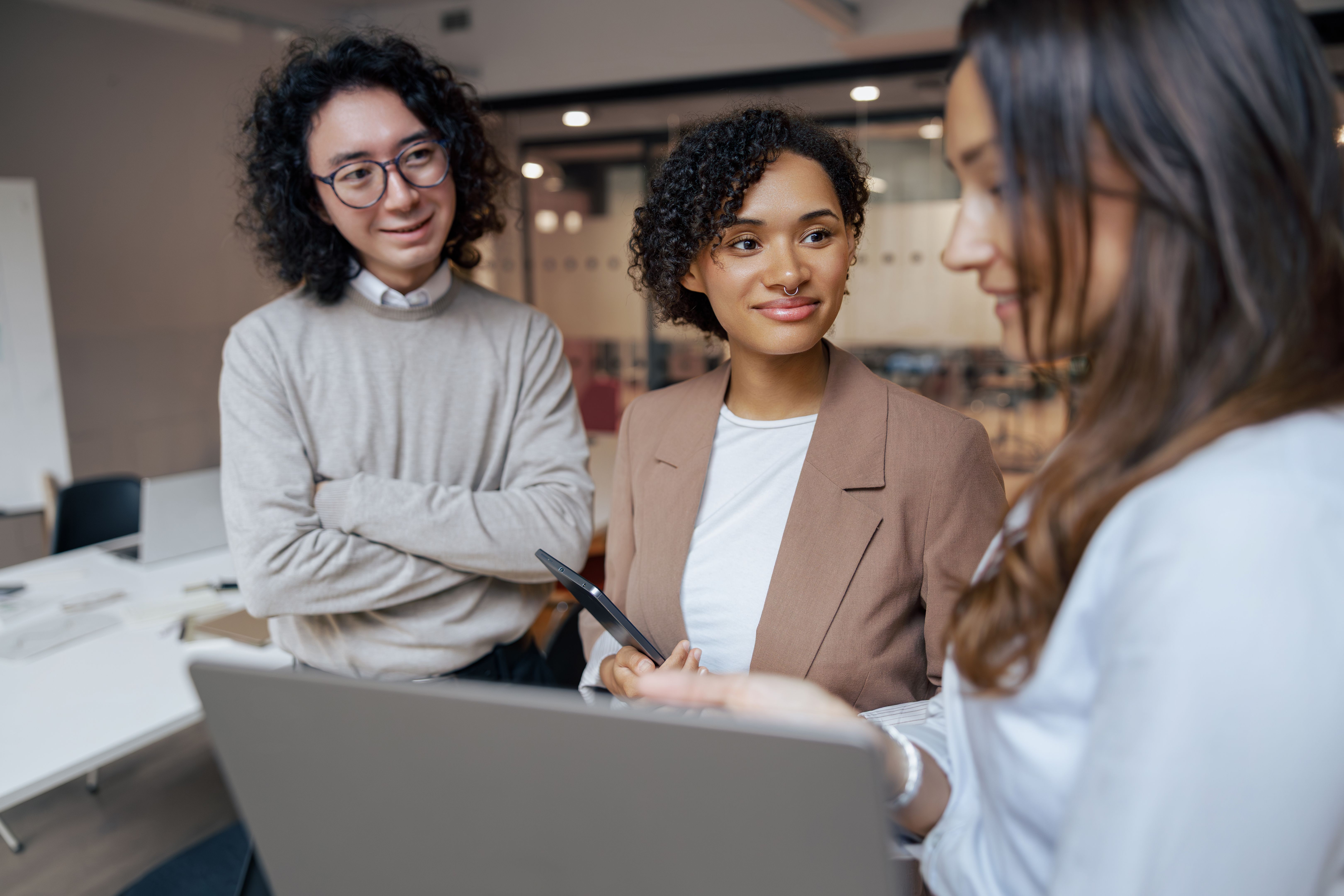 Engaging in a Collaborative Business Meeting with Colleagues in a Modern Office Space