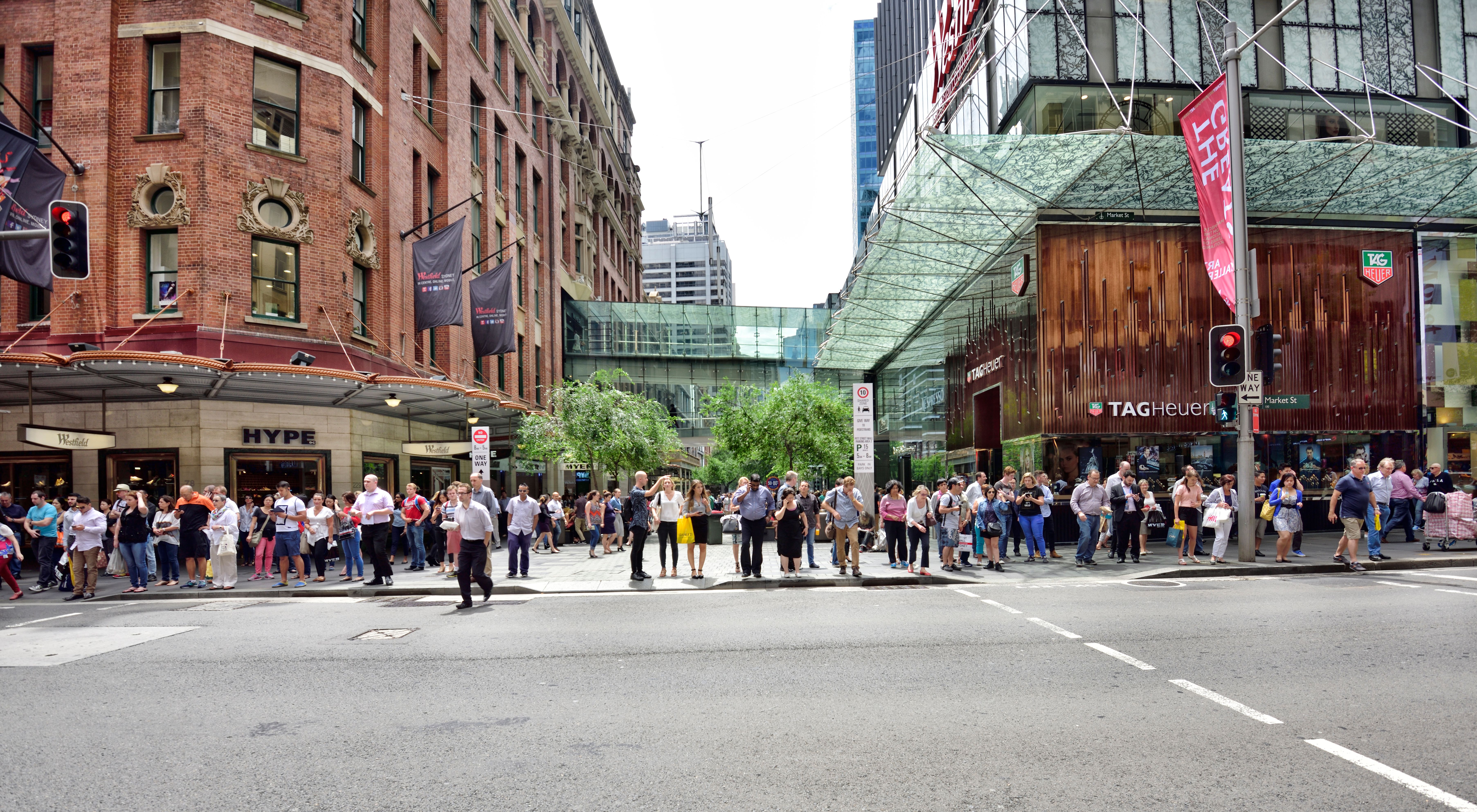 People crowd crossing street in central Sydney
