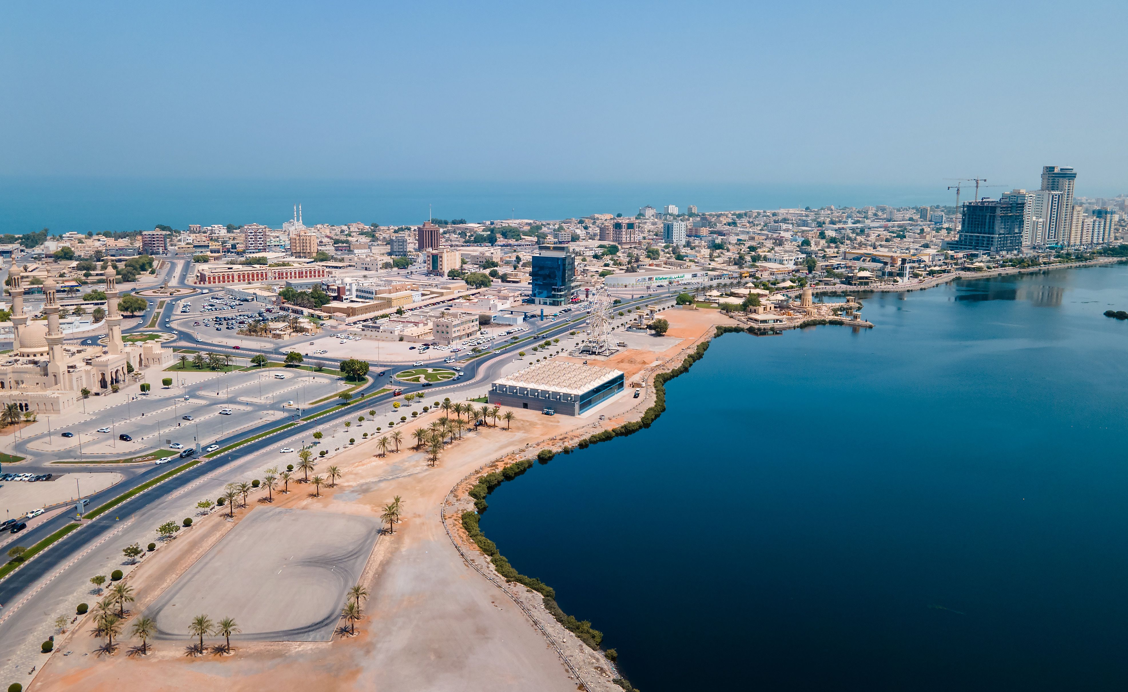 Ras al Khaimah emirate aerial cityscape landmark skyline rising over the mangroves and the creek in the northern UAE