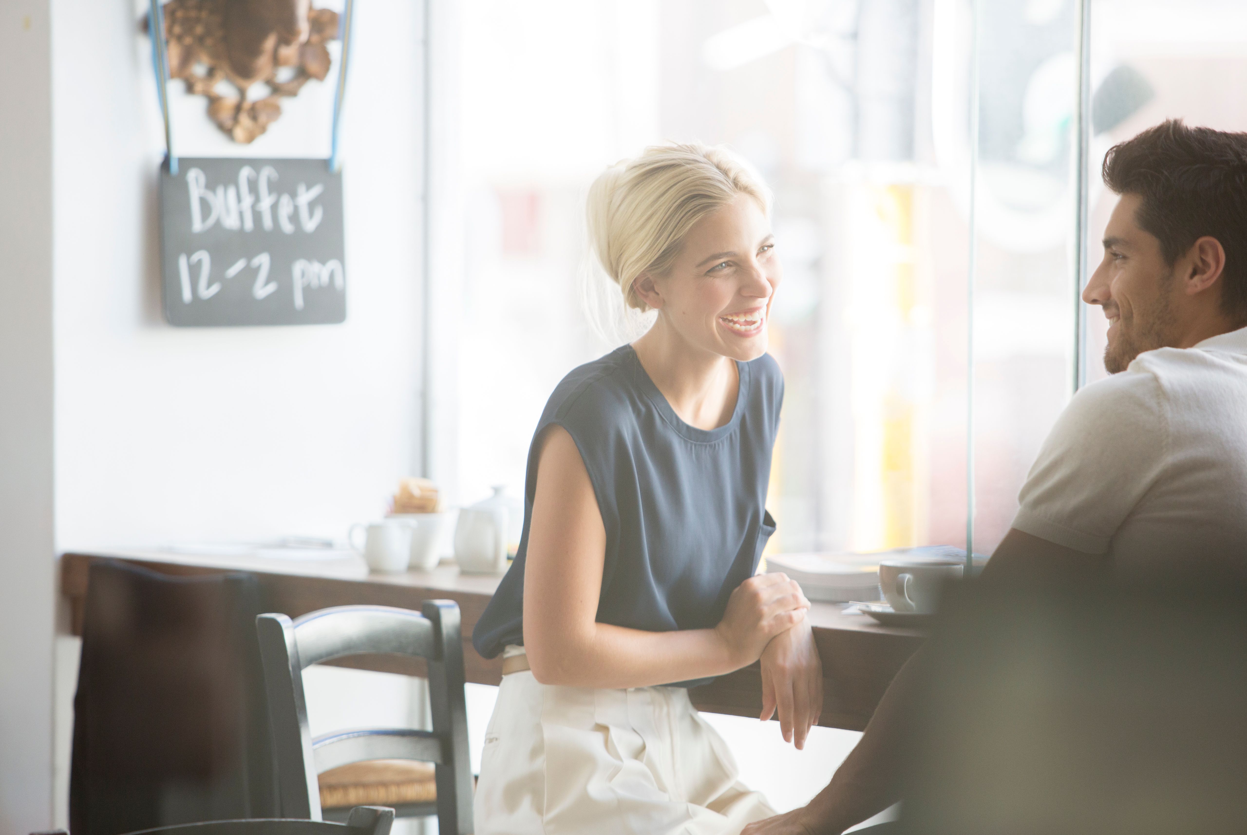 Couple talking in cafe