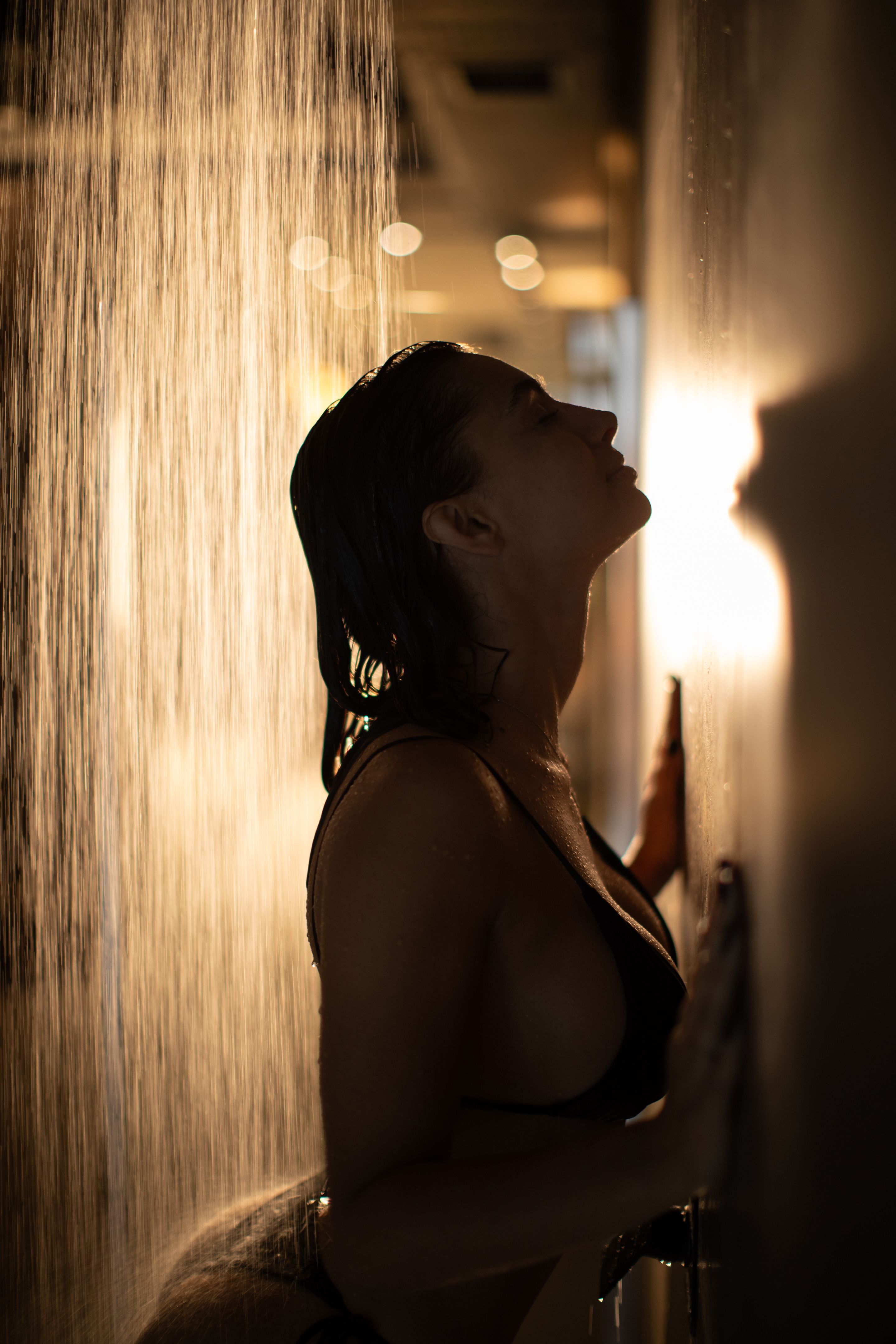 Very attractive woman taking a shower