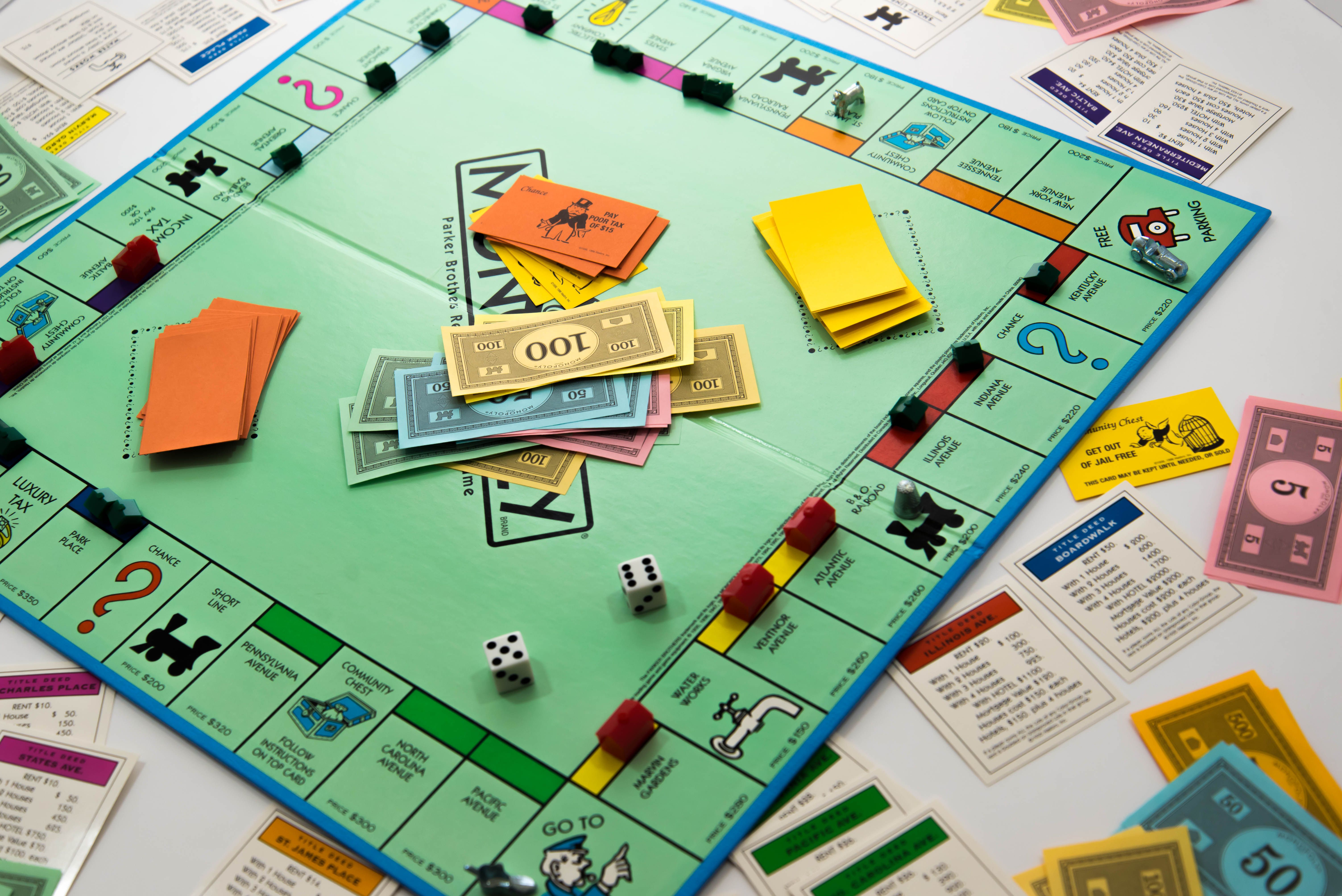Monopoly game in play - money, dice, pieces and cards