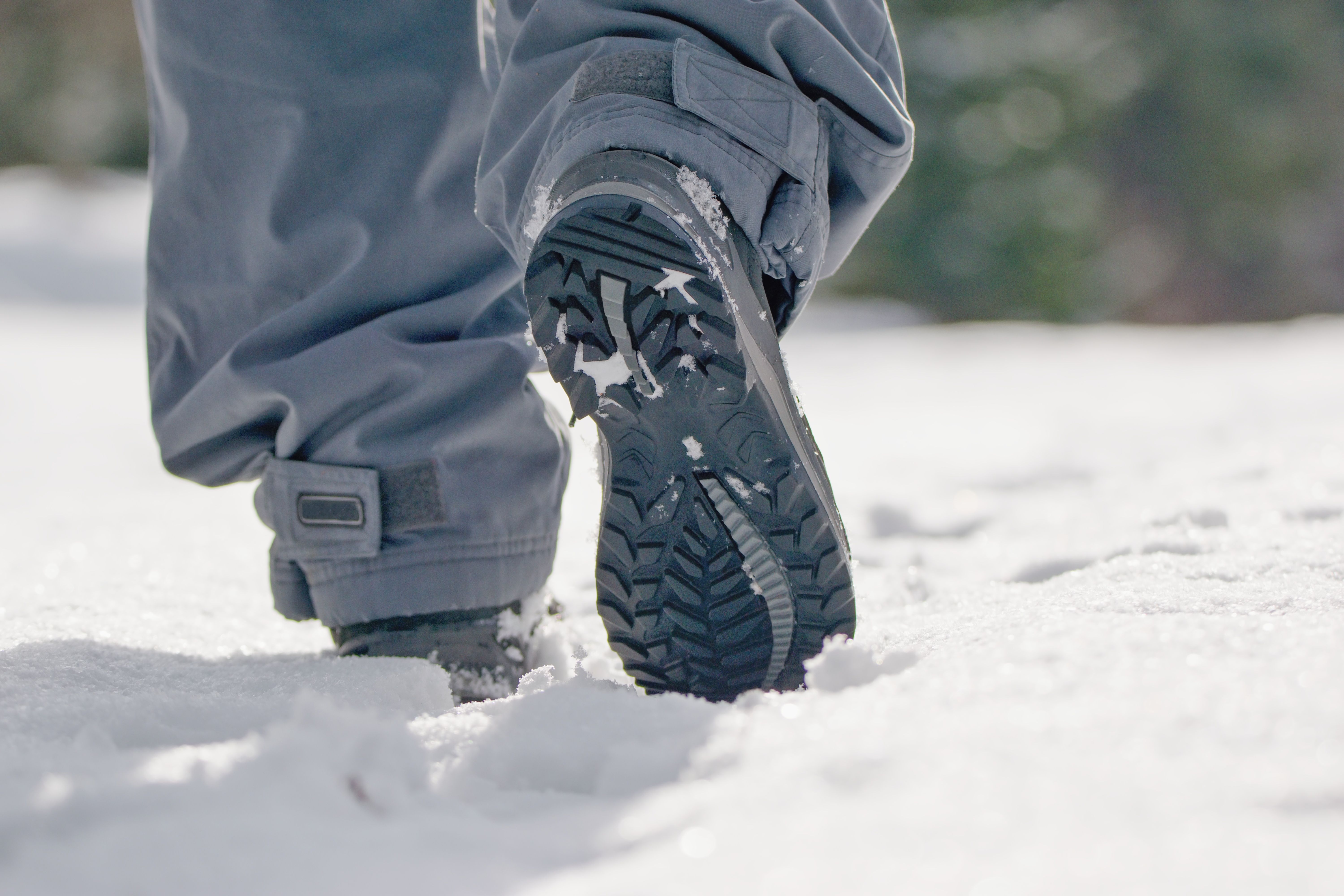Man walking in the fresh white snow