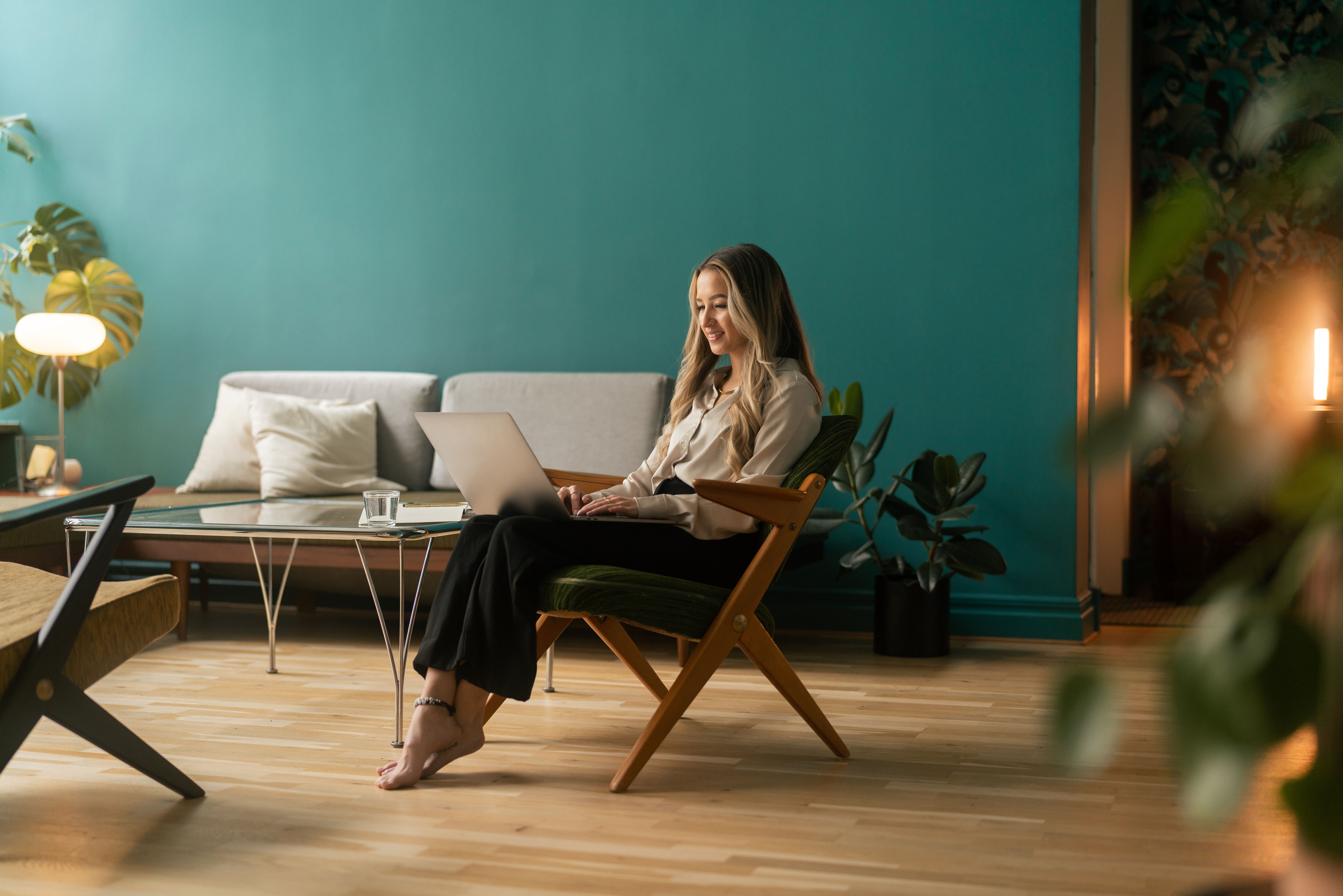 Woman typing on her laptop at home