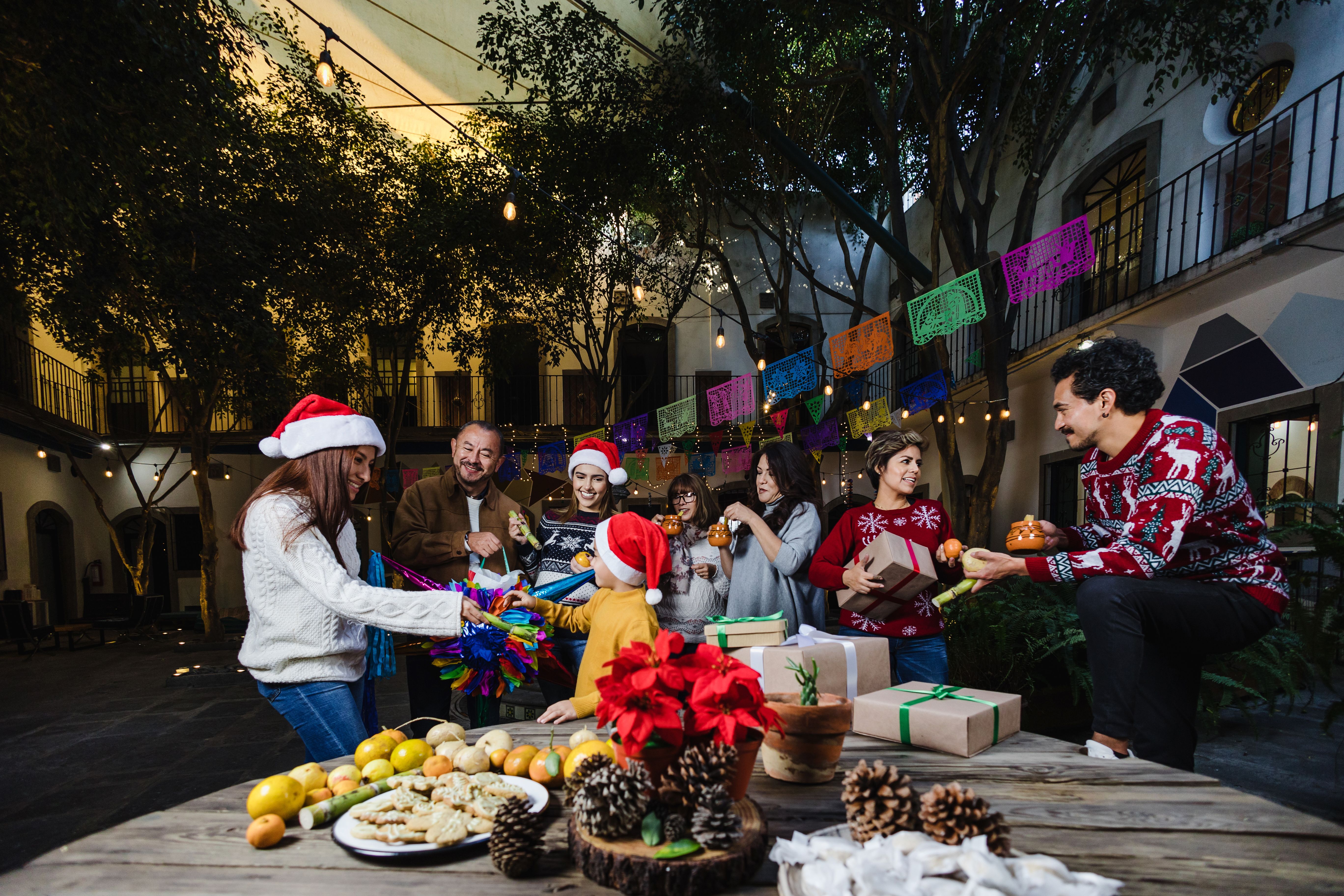 Mexican Family celebrating traditional party or posadas for Christmas eve and holidays in Mexico Latin America