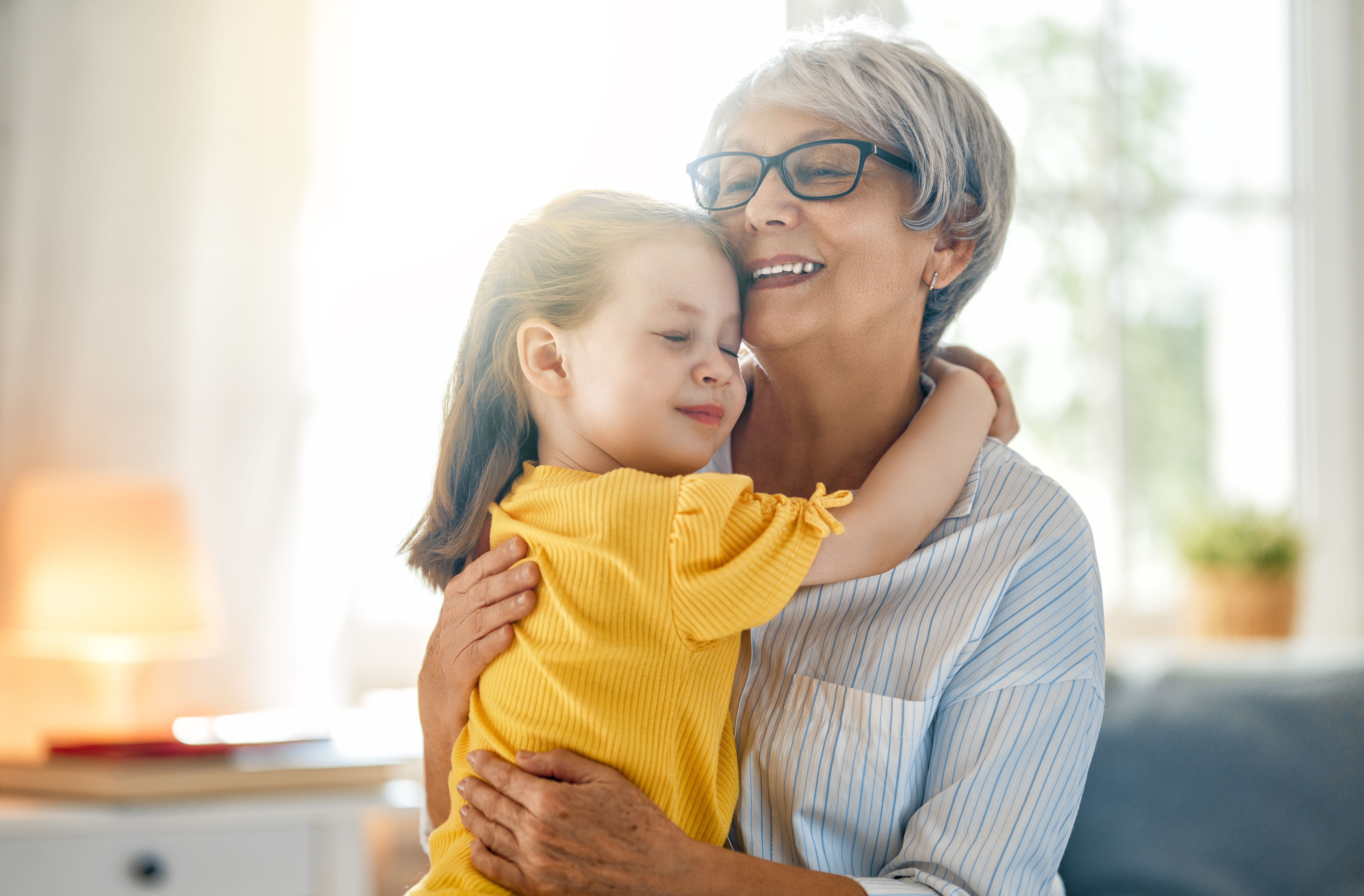 girl and her grandmother enjoying sunny morning