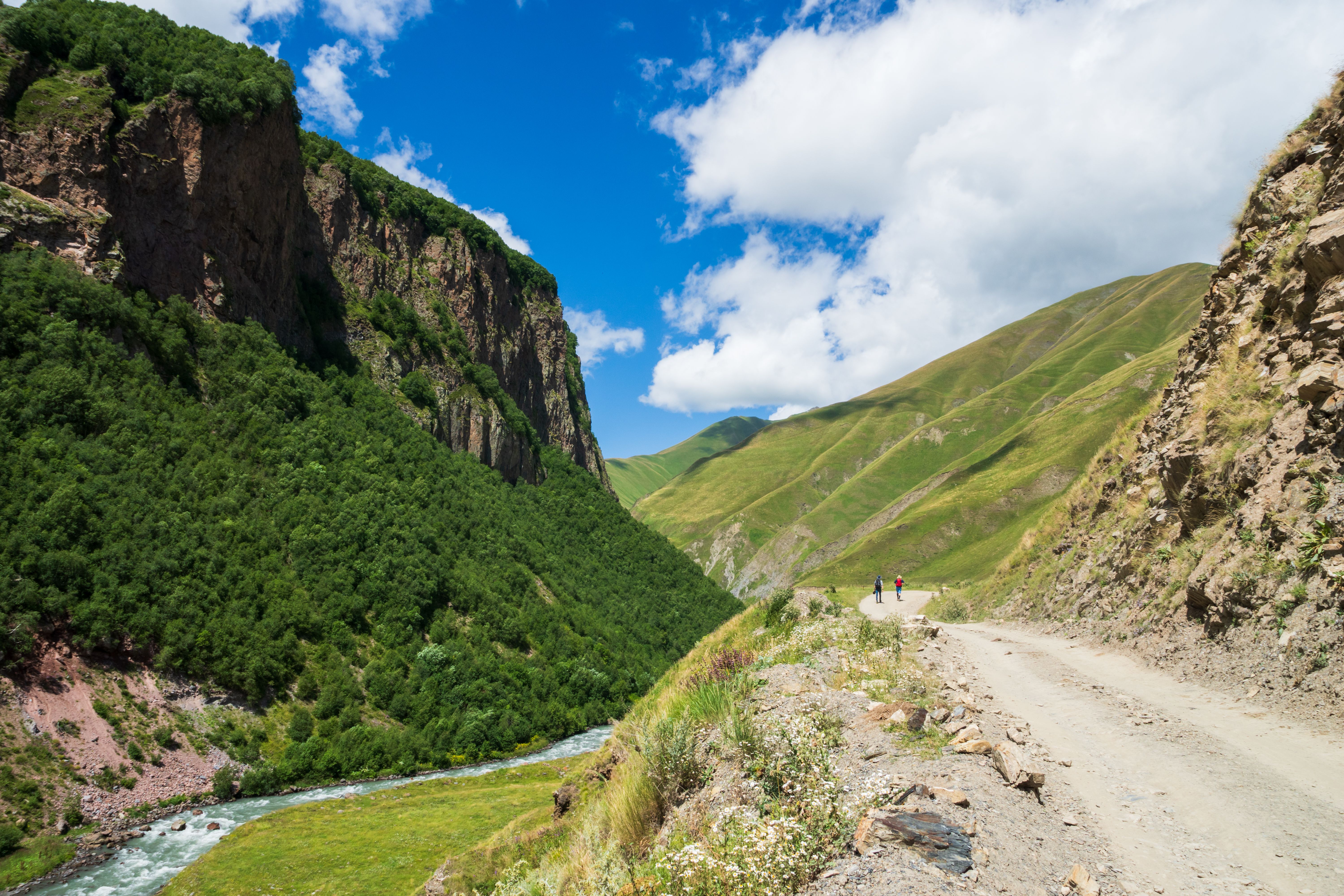 Summer hiking landscape in Georgia, Caucasus mountains in Kazbegi, Truso Gorge area Summer hiking landscape in Georgia, Caucasus mountains in Kazbegi, Truso Gorge area