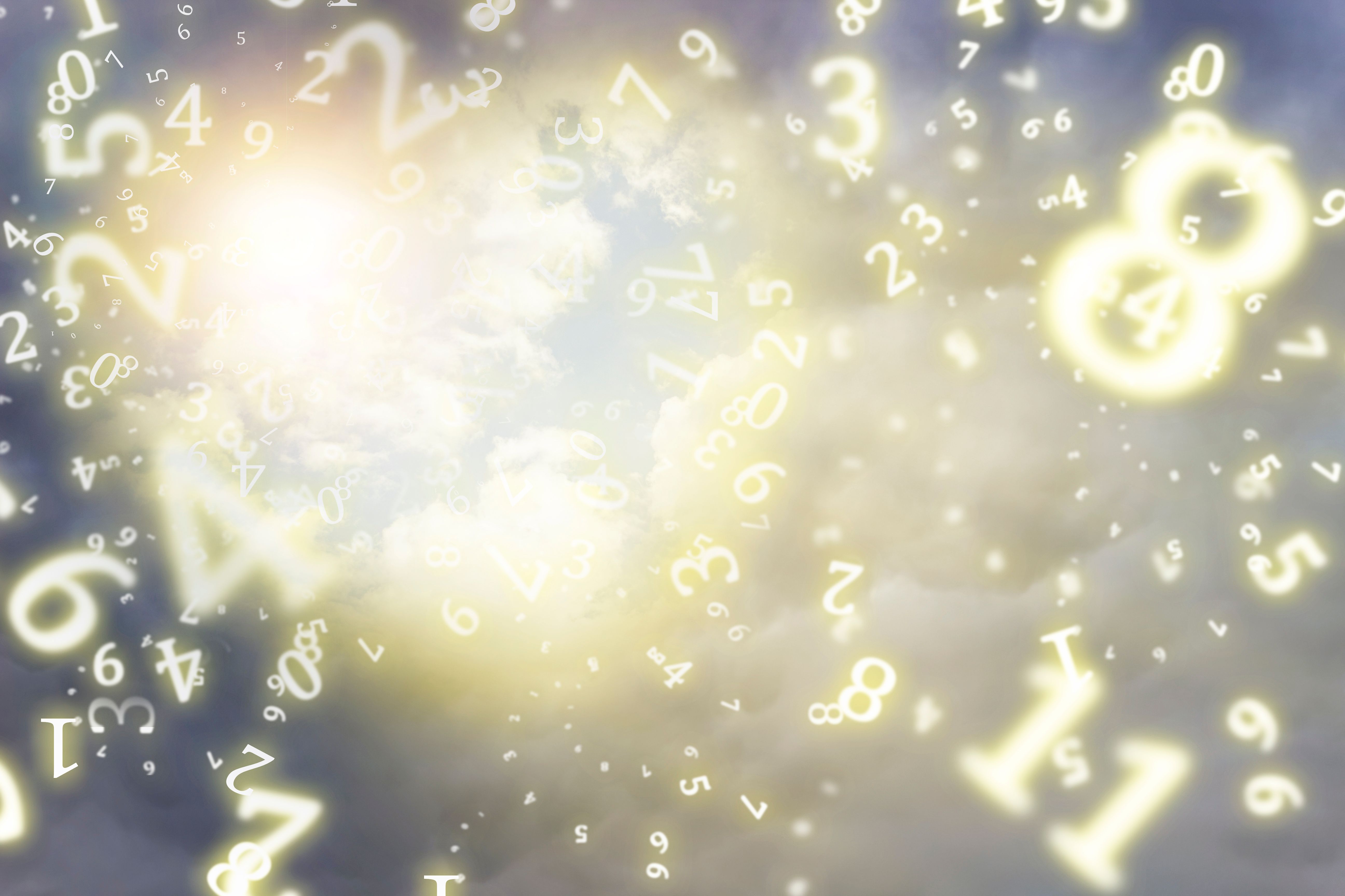 numerology, heart in the sky among the clouds. Sunlight in a cloudy sky in the shape of a heart. Beautiful love background, surrounded by numbers