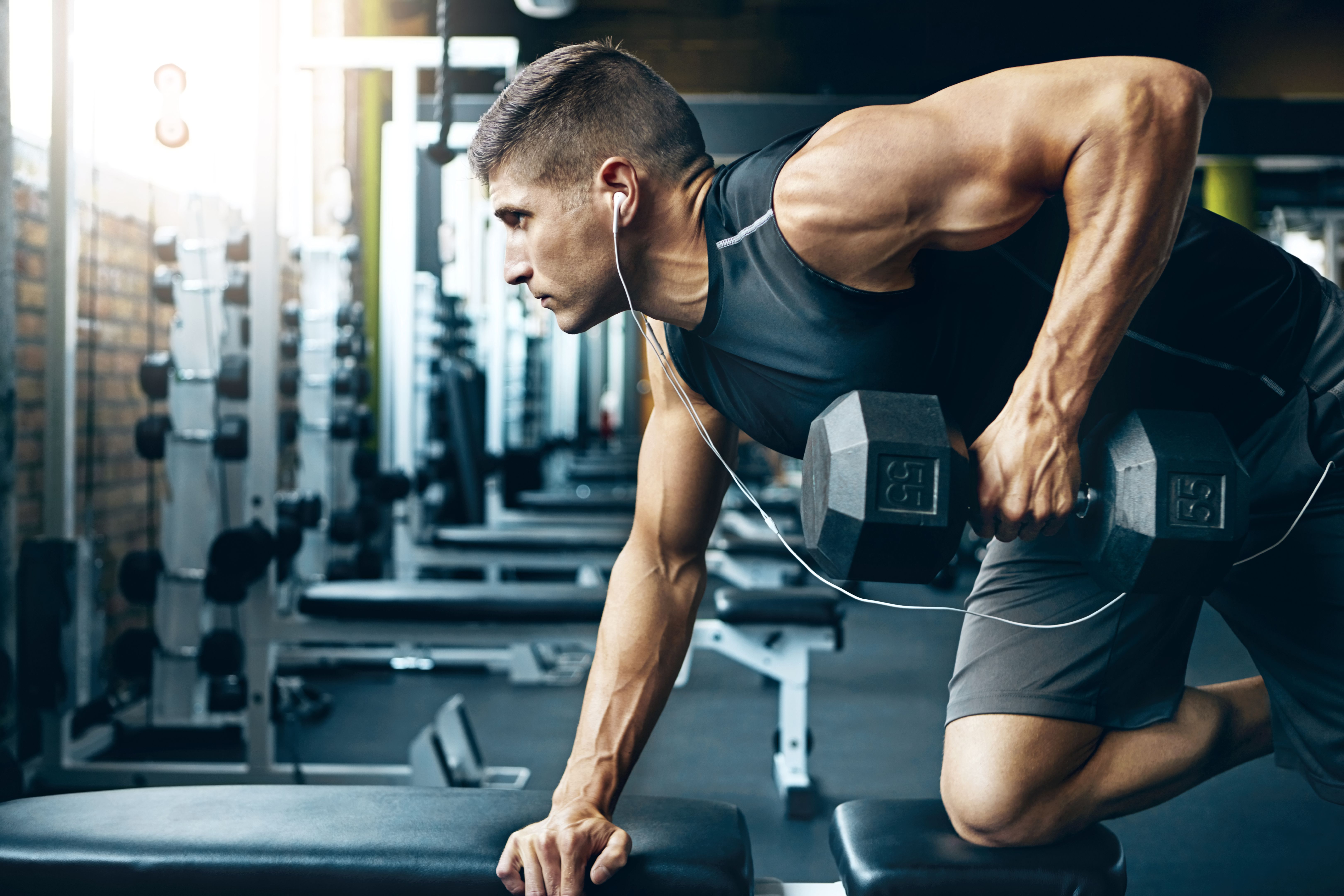 man lifting weights