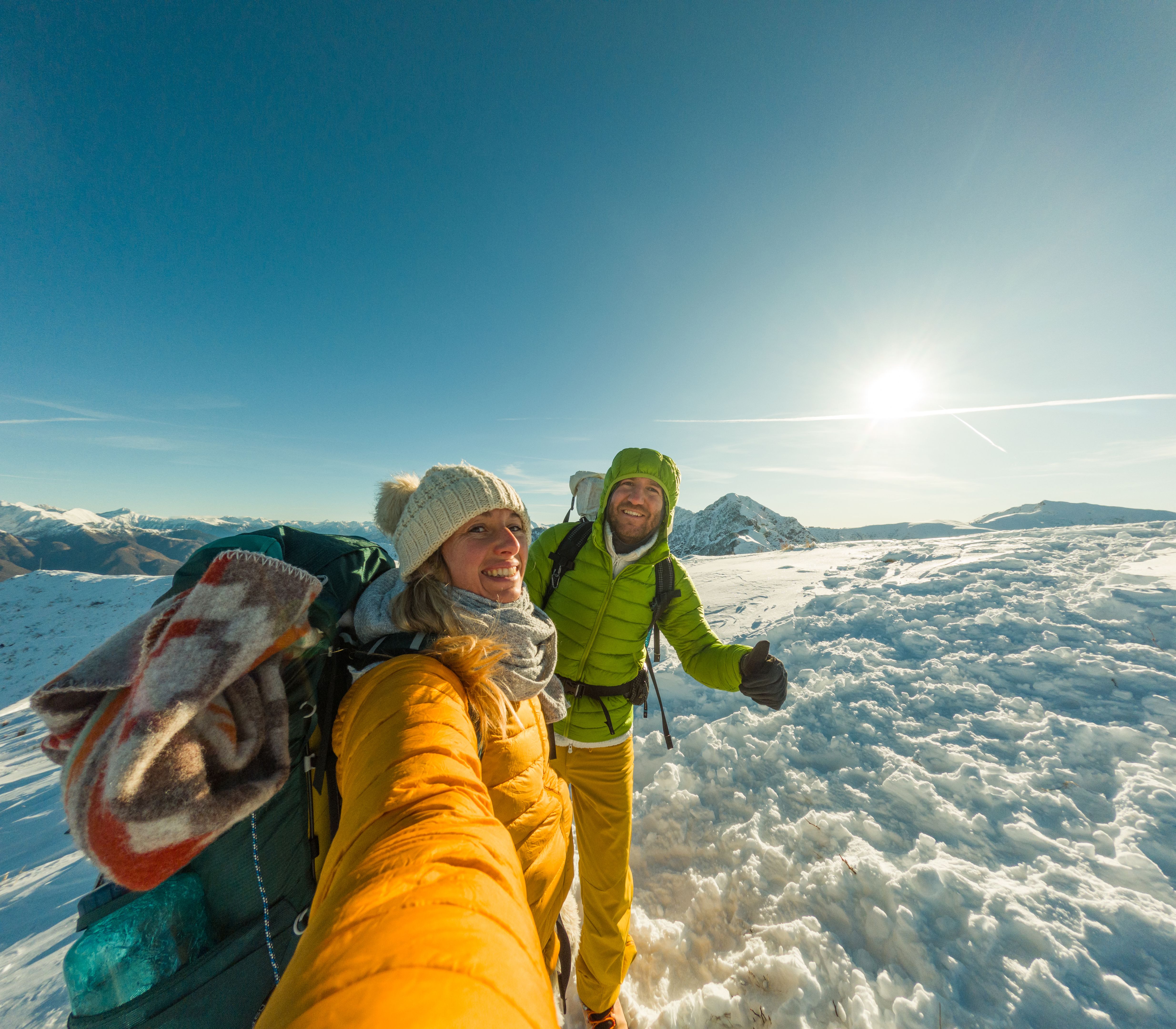 Couple's selfie on a sunny day during a winter hike
