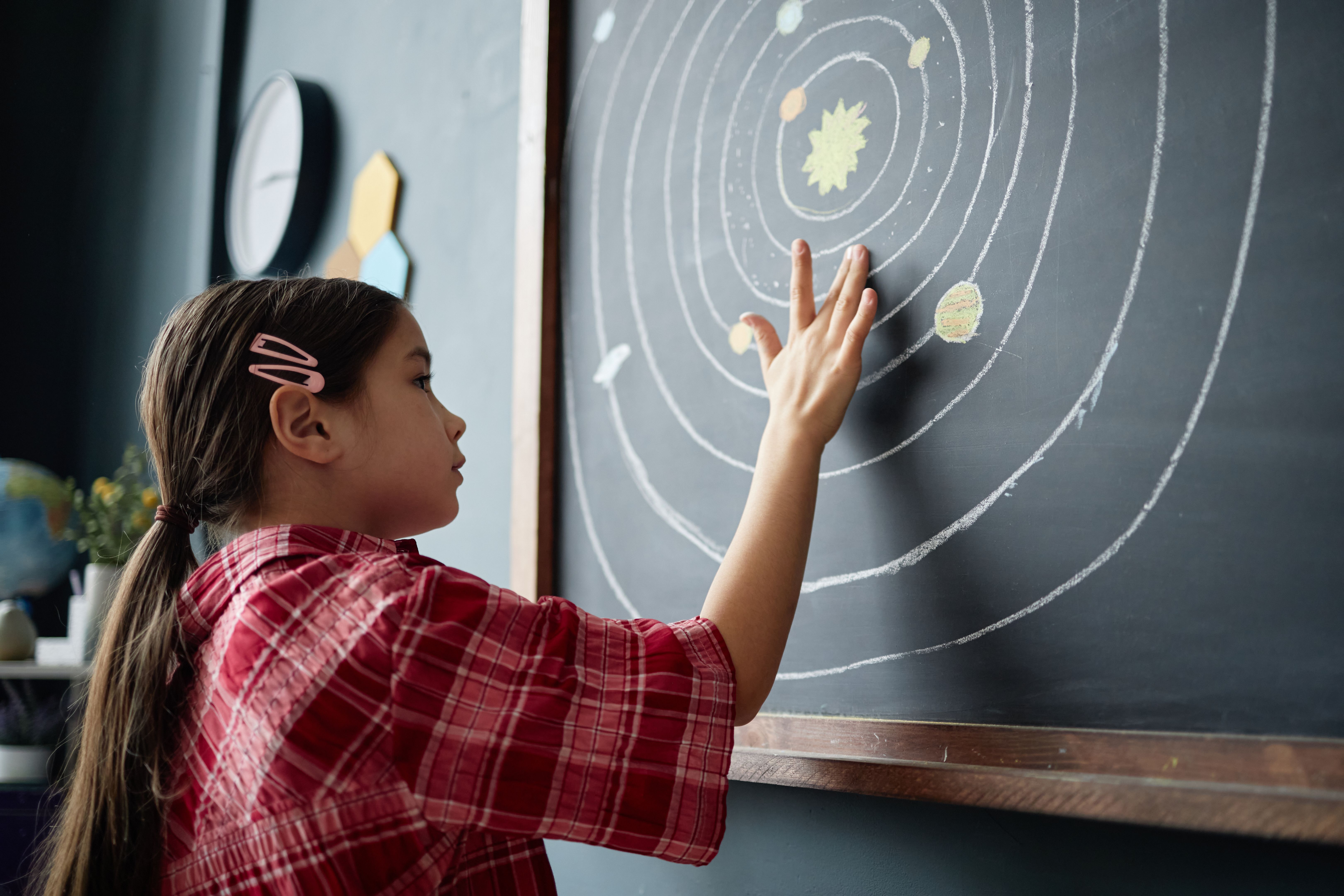 child exploring science