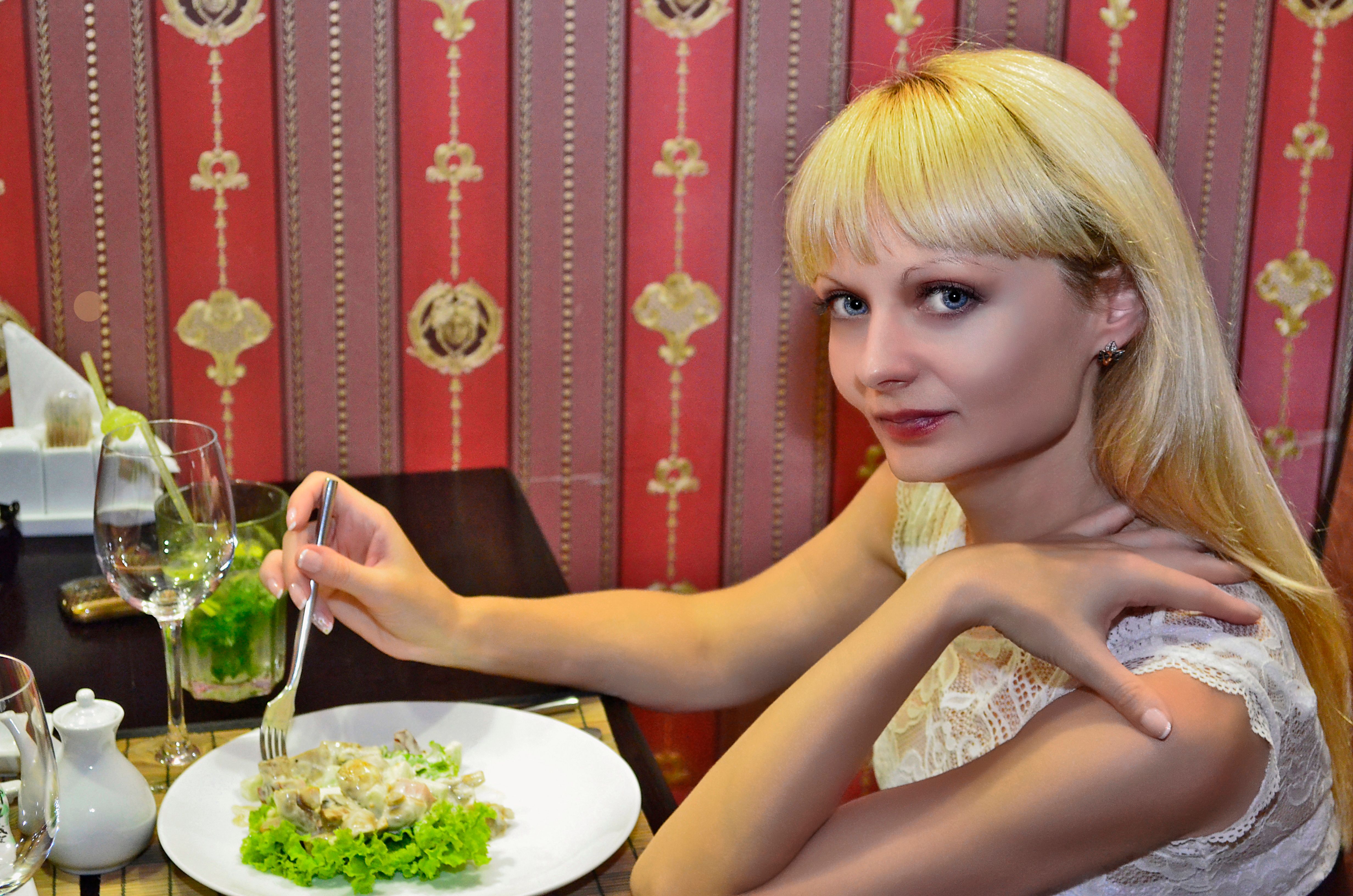 A man and a woman, husband and wife, are having dinner in a restaurant. A man and a woman, husband and wife, are having dinner in a restaurant.