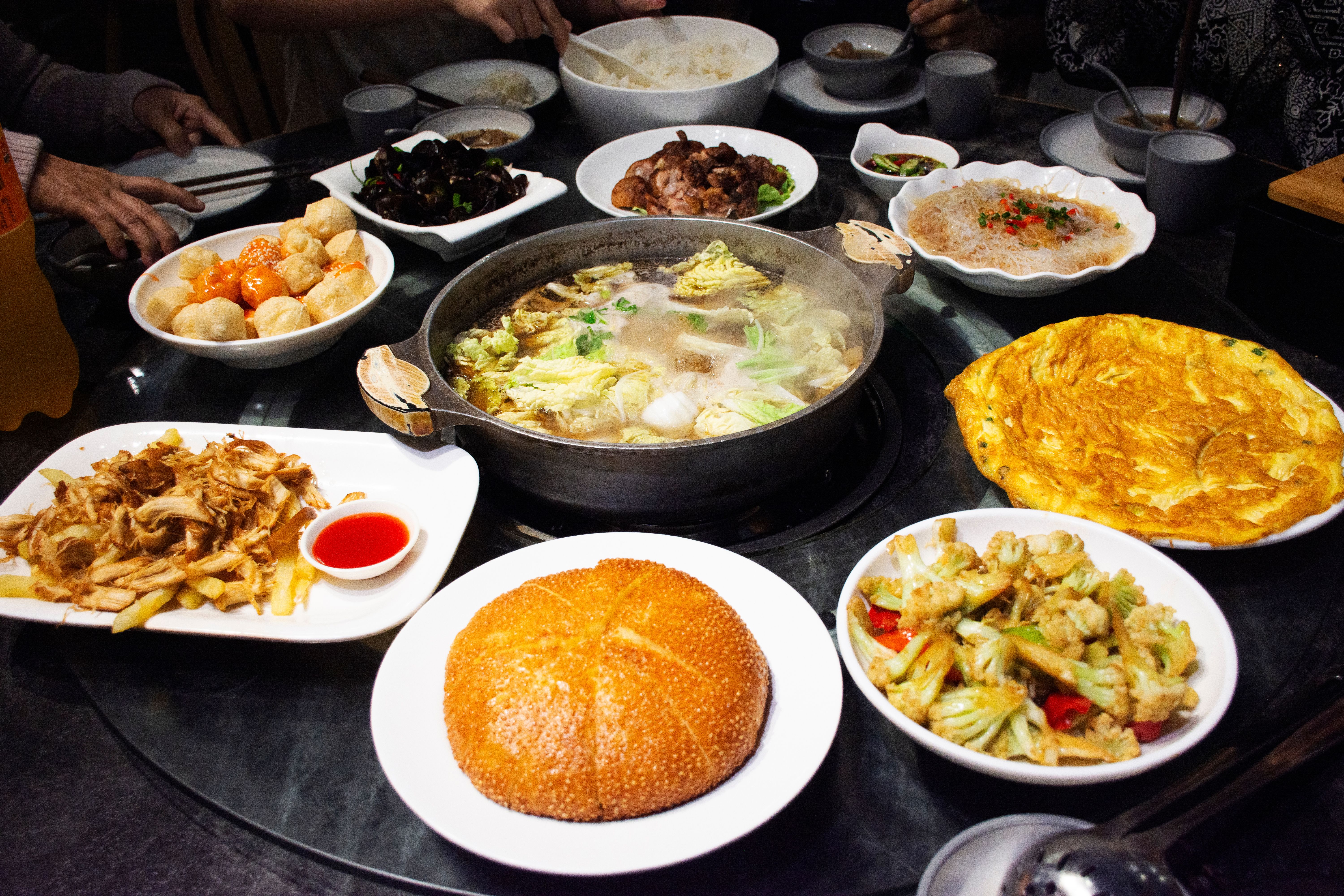 Traditional chinese food gourmet meal set or local cuisine meal cultural tribe food on table for serve customers people travelers taste eat and tasty drink in restaurant at Zhangjiajie in Hunan, China