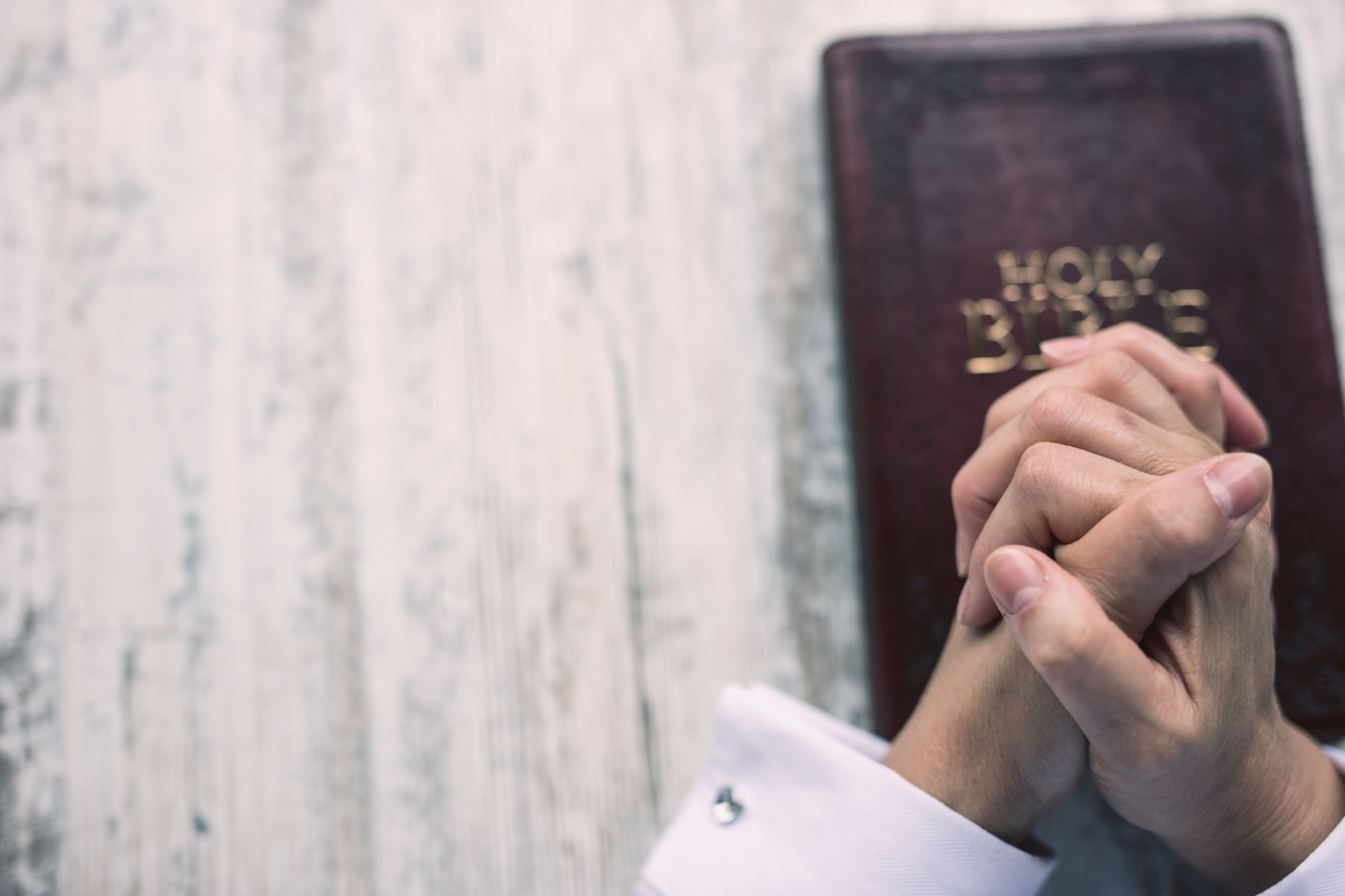 Woman praying for her family Woman praying for her family
