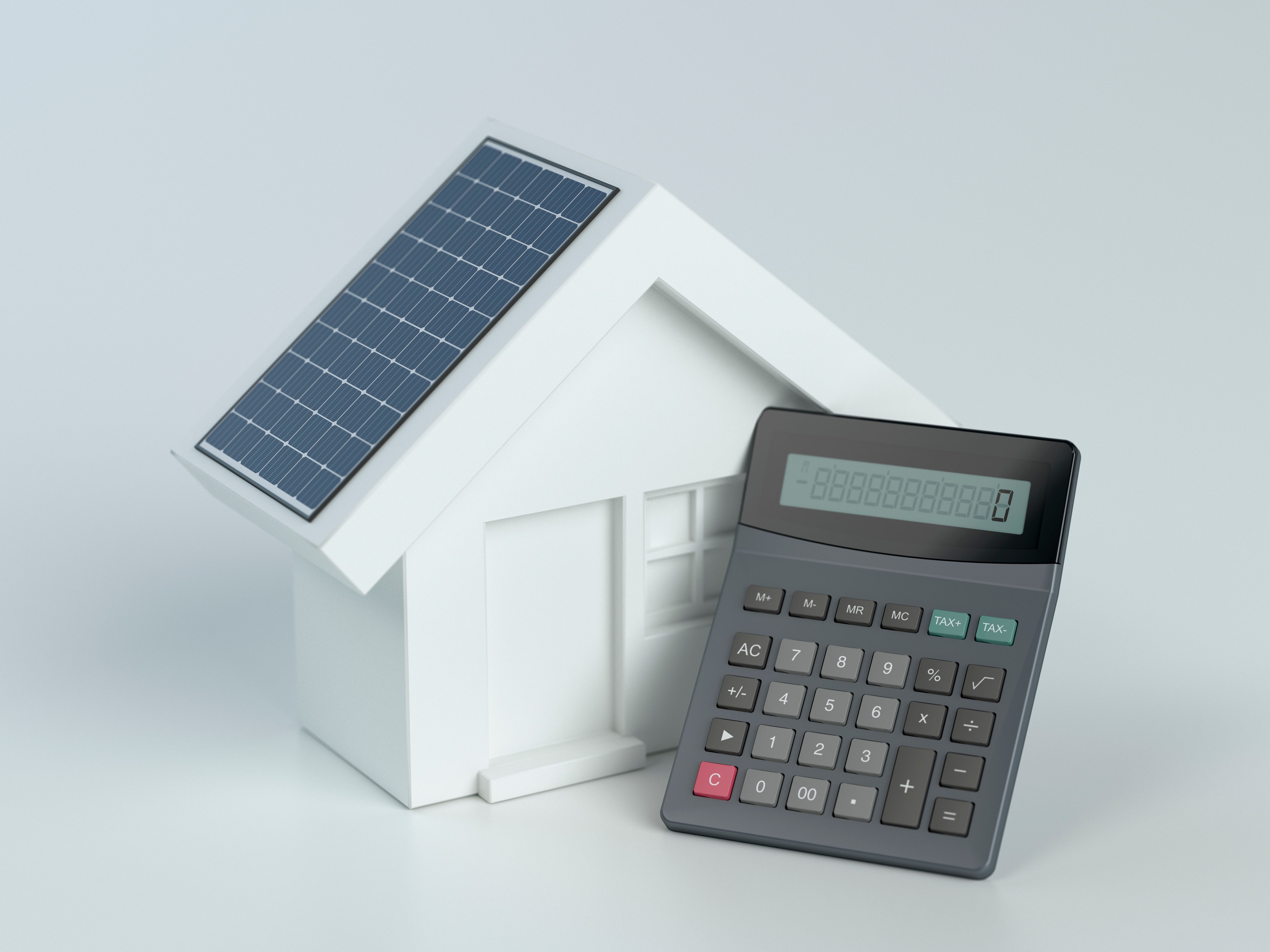 House with photovoltaic solar panel and calculator on white background House with photovoltaic solar panel and calculator on white background