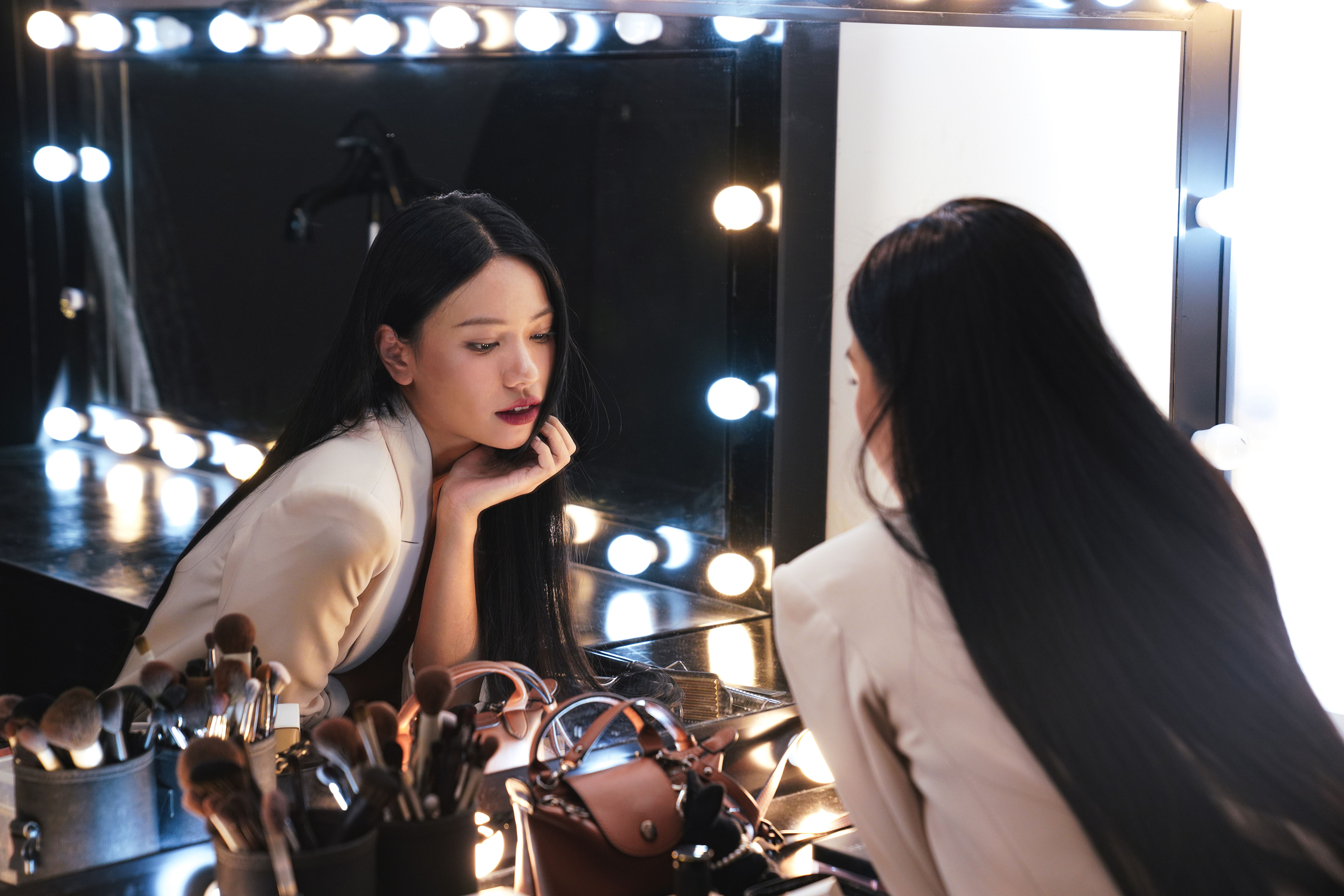 Young female model in the make-up room