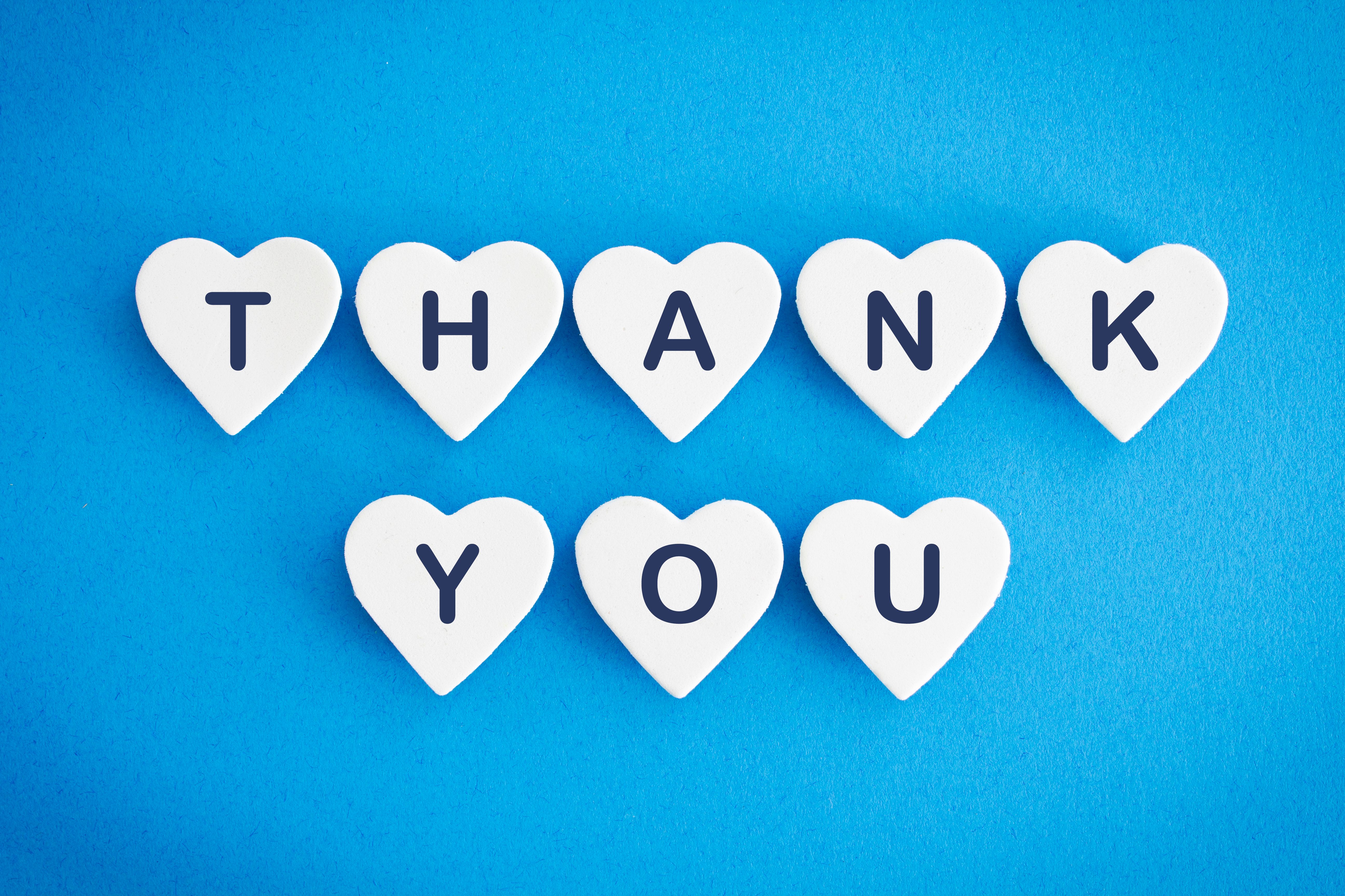 Thank you on blue background Thank you on blue background