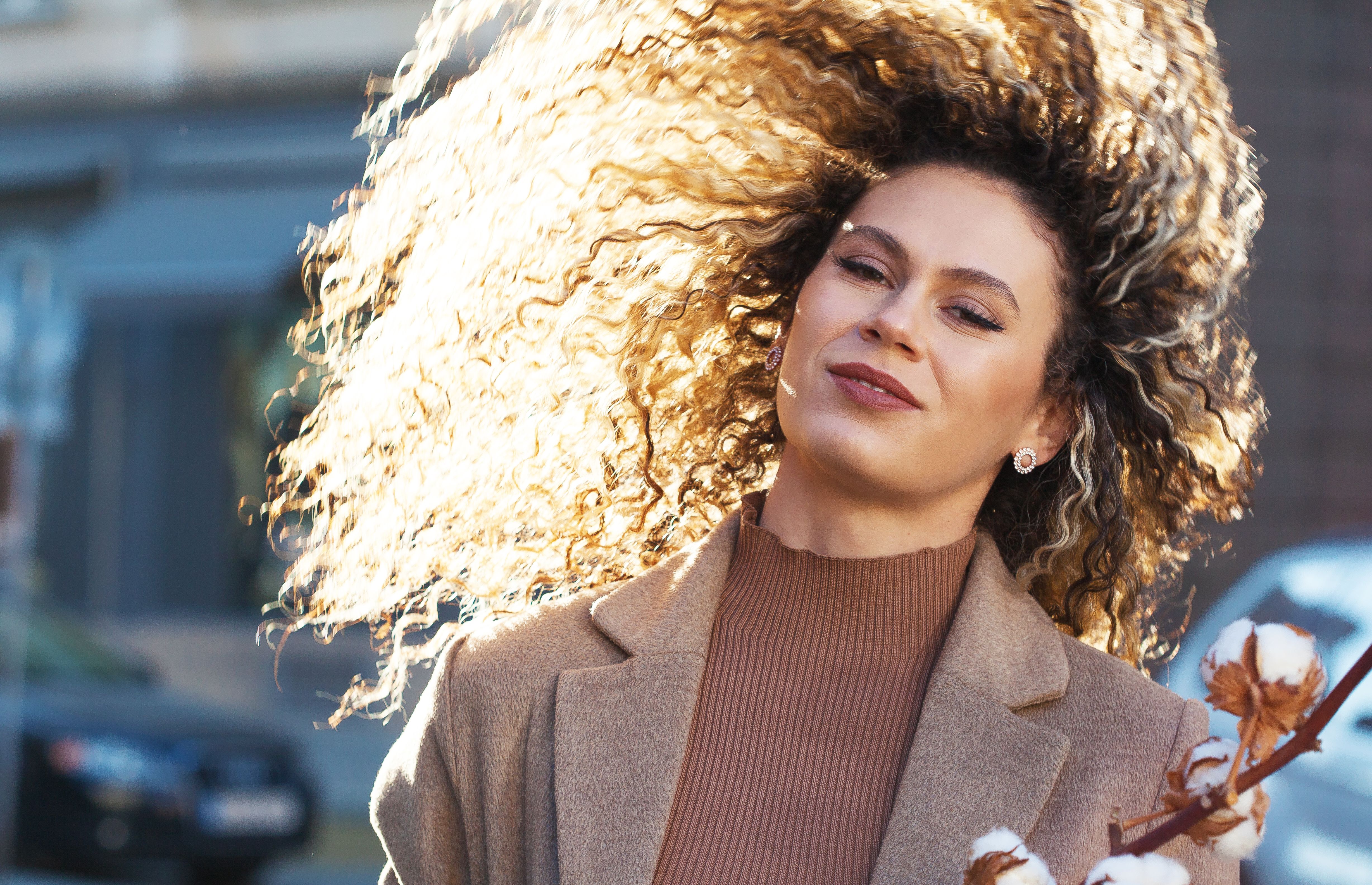 Young woman tossing hair