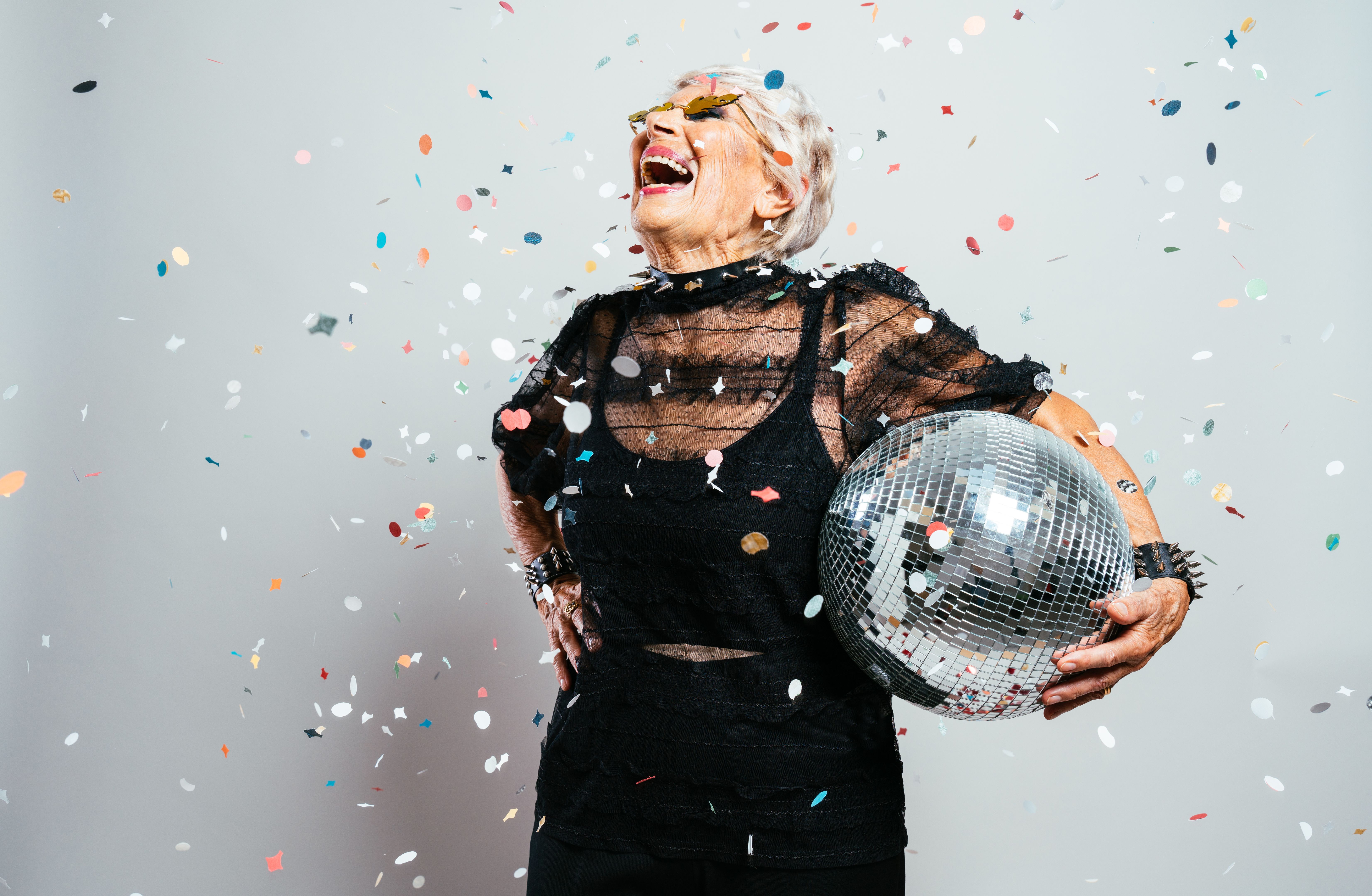 Portrait Of Young Woman Standing Against Wall