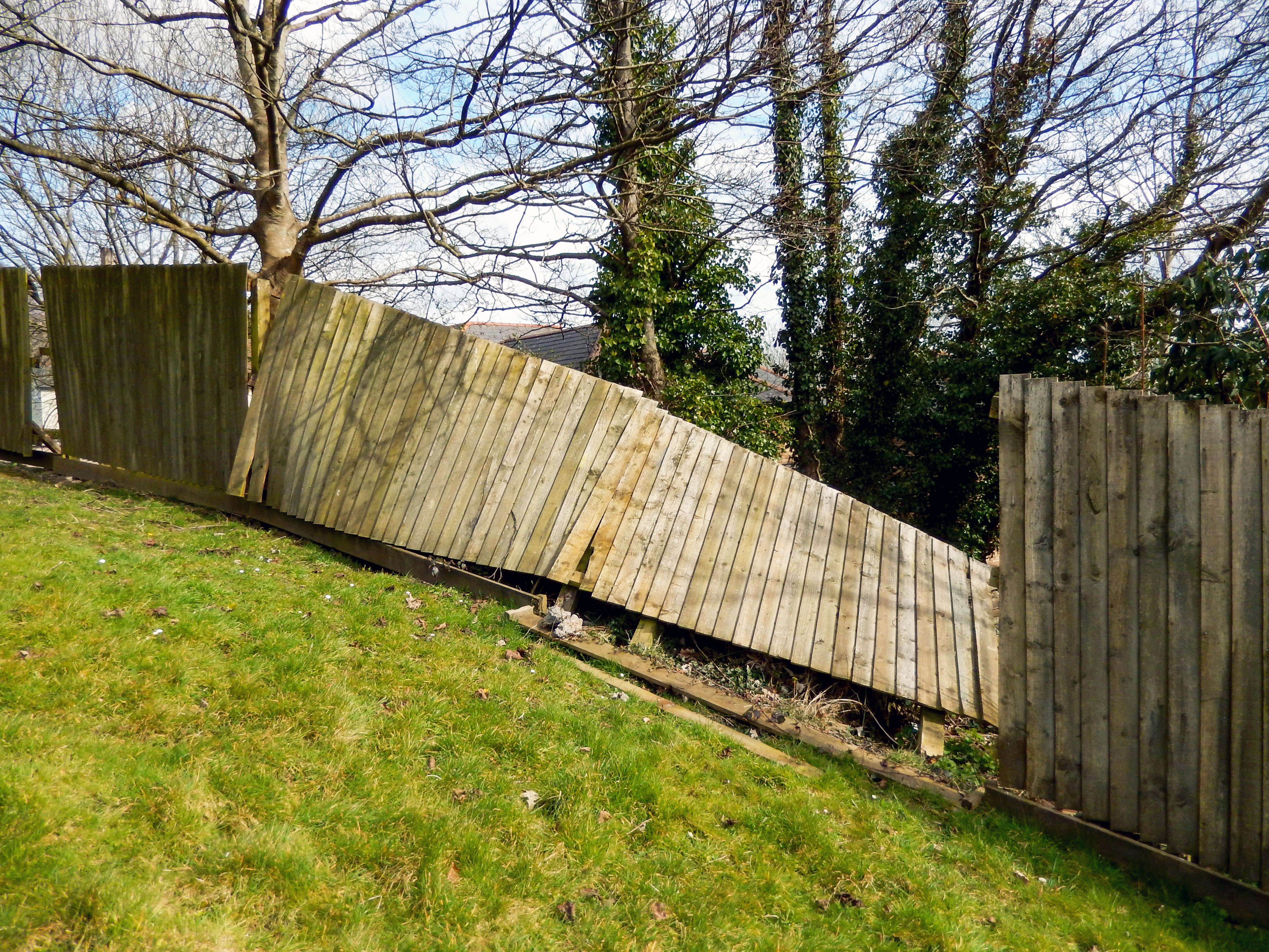 hurricane damage fence