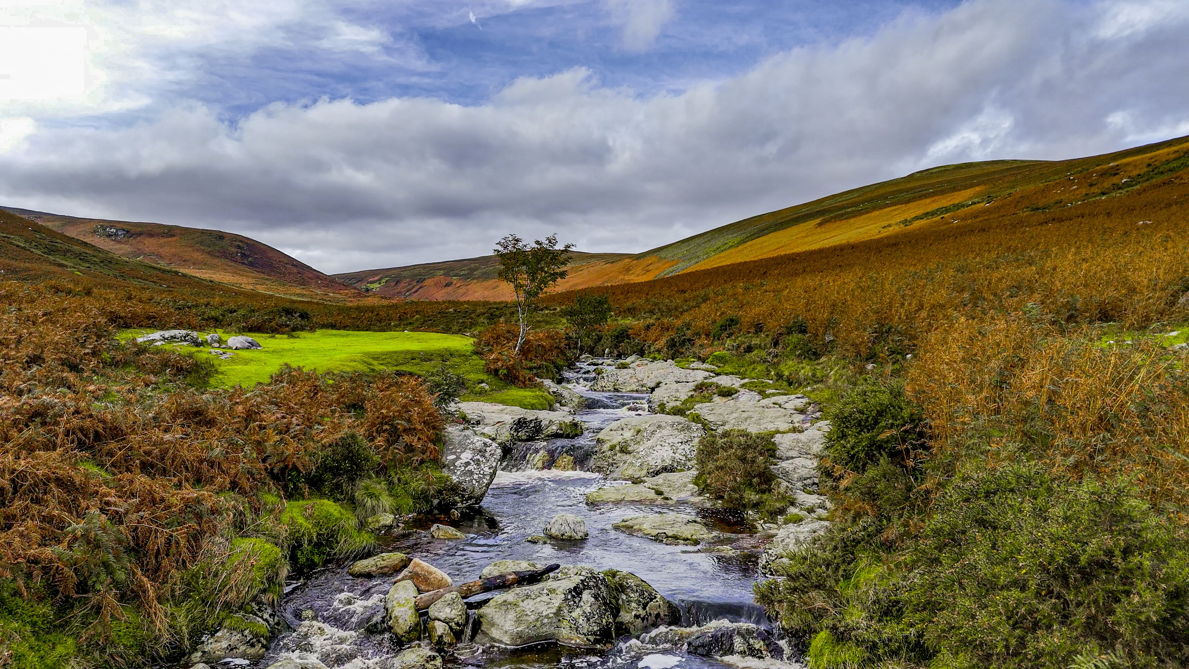 aerial view of wicklow mountain in ireland, aerial view of ireland nature, popular tourist destination in ireland, aerial view of the river flowing through wicklow mountain, Aerial view of beautiful valley and river in the mountains