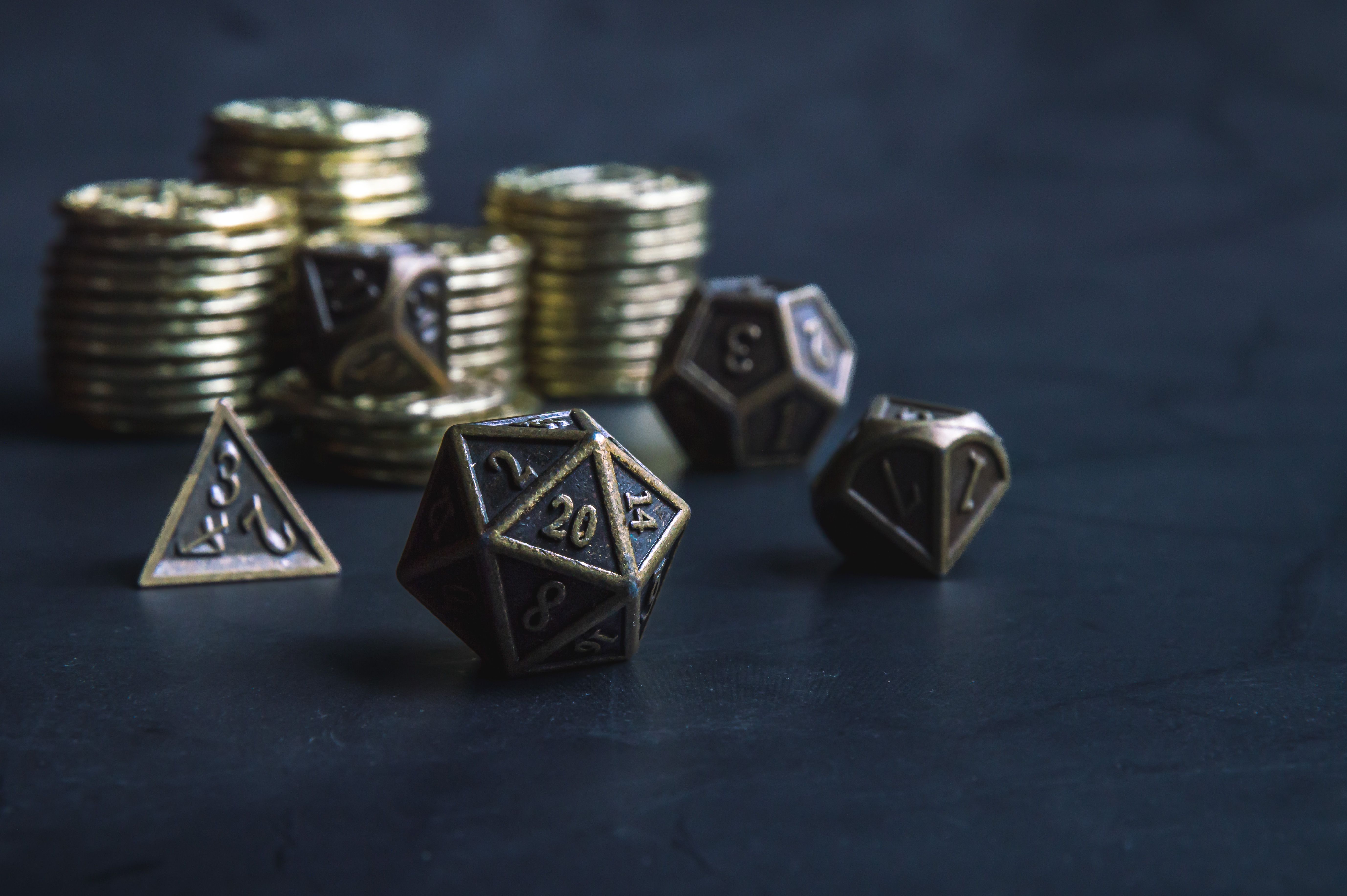 Close-up of a set of RPG dice and coins