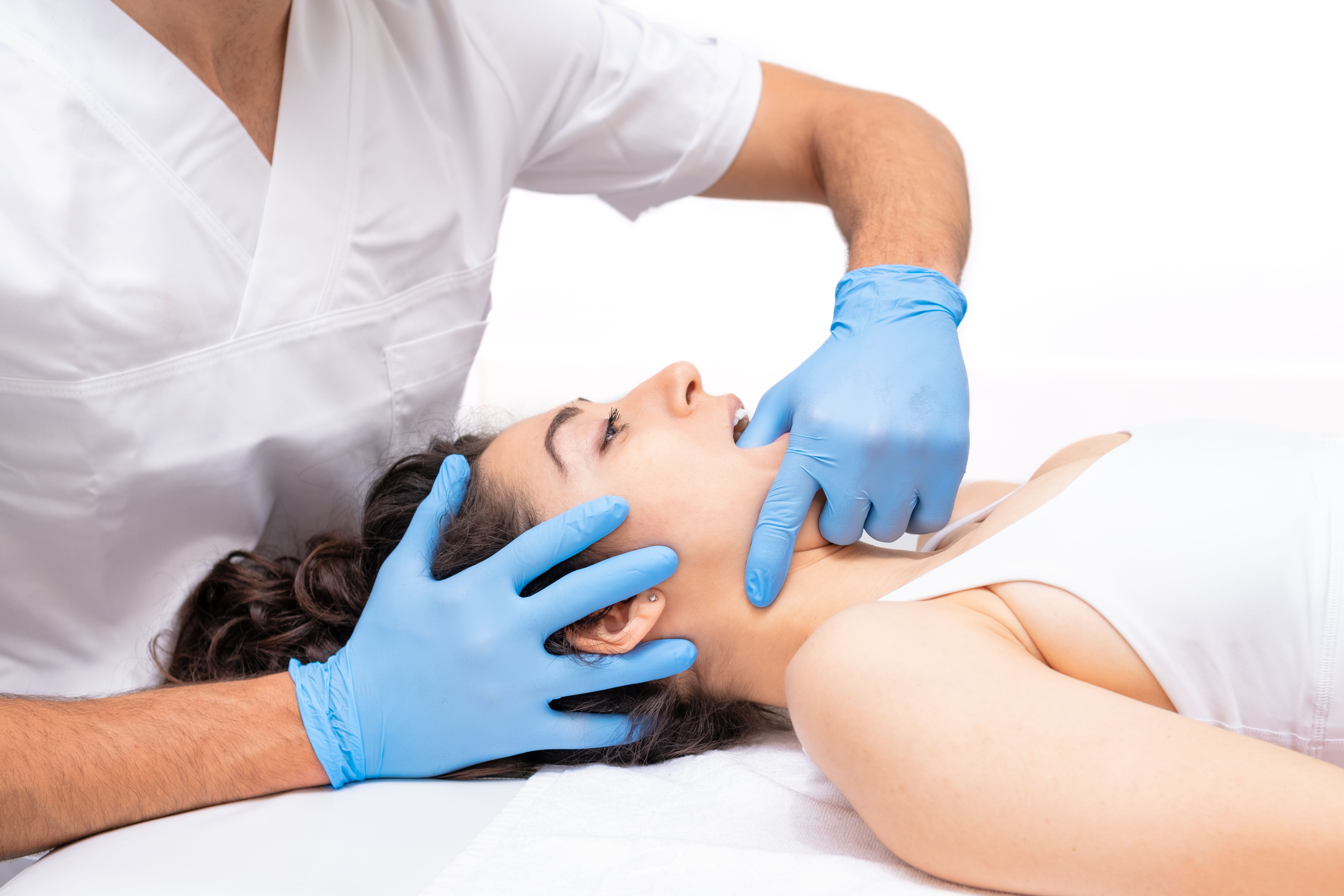 Patient undergoing craniosacral biodynamic therapy. Osteopathy manipulation., Patient undergoing craniosacral biodynamic therapy. Osteopathy manipulation.,