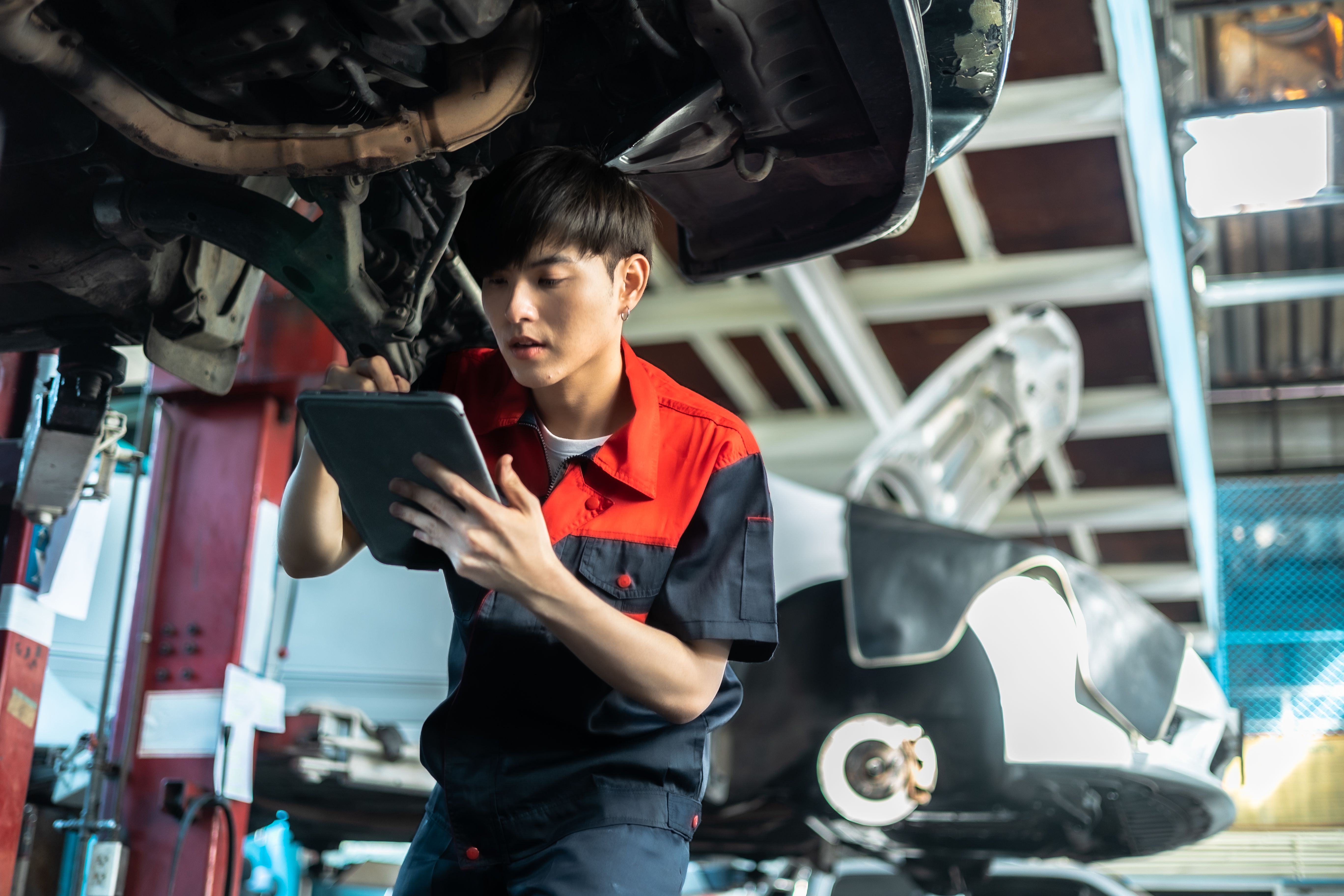 mechanic checking car