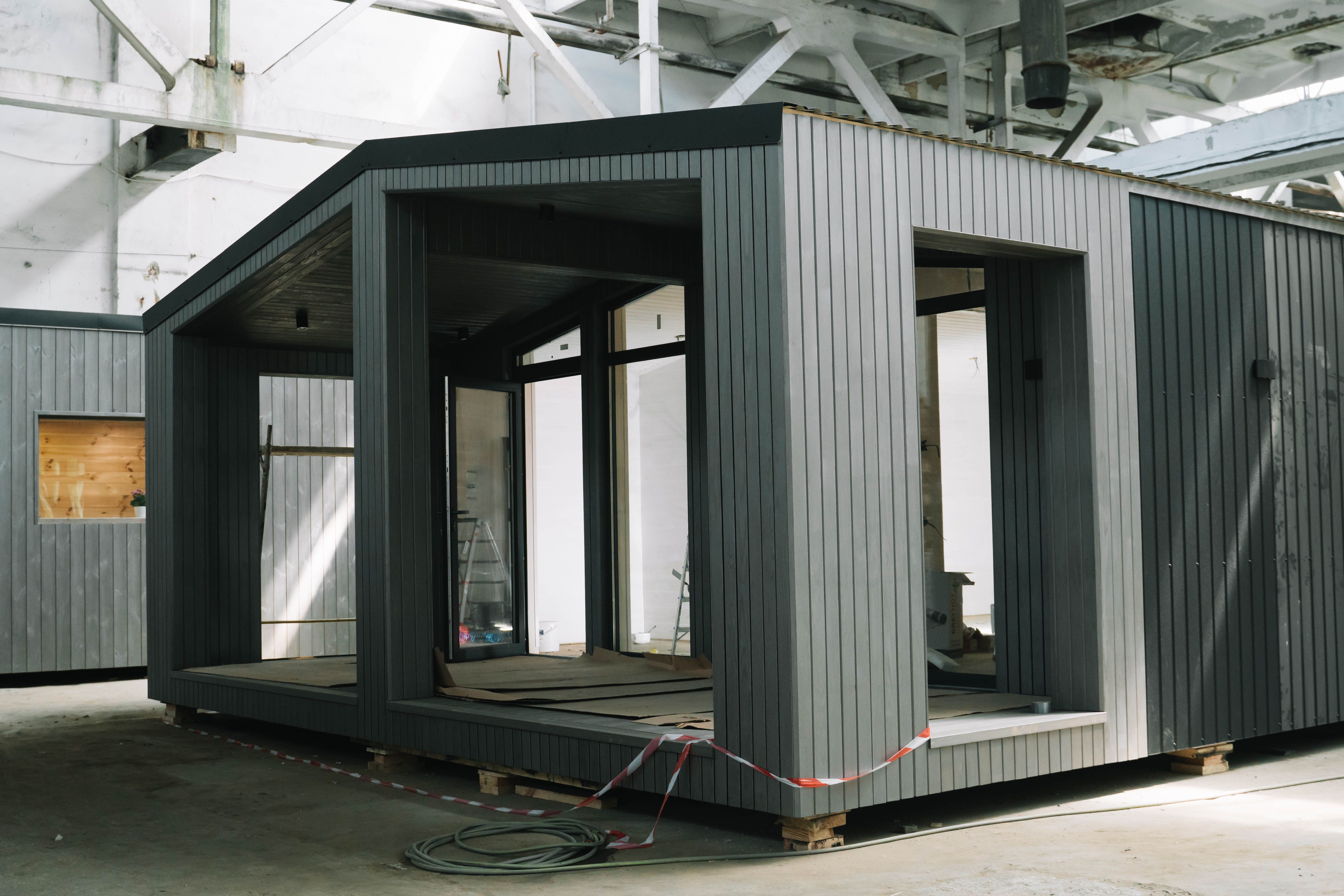 A new wooden modular prefabricated house inside in manufacturing facility A new wooden modular prefabricated house inside in manufacturing facility
