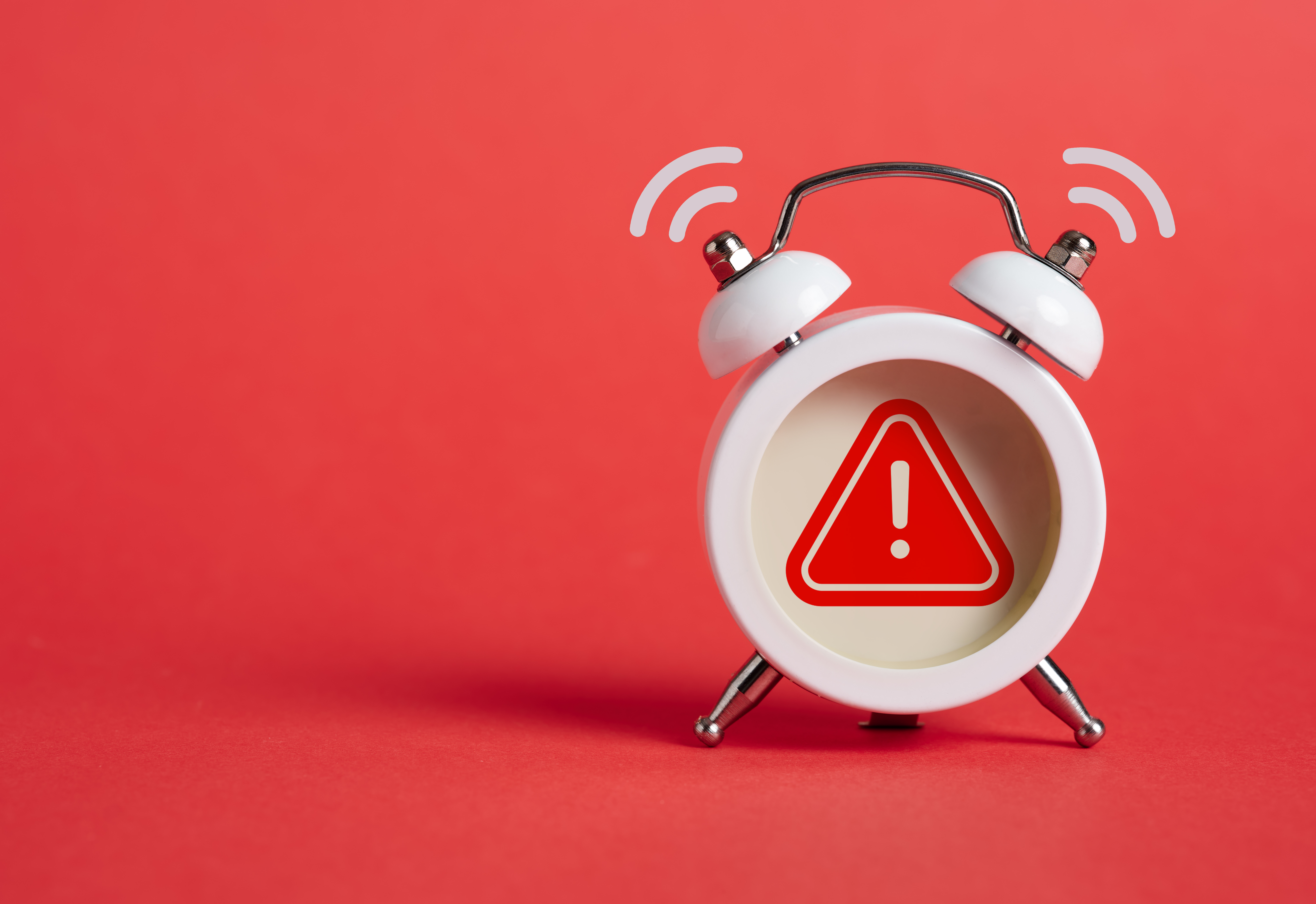 Caution, warning or exclamation sign inside of an alarm clock. Caution, warning or exclamation sign inside of an alarm clock.