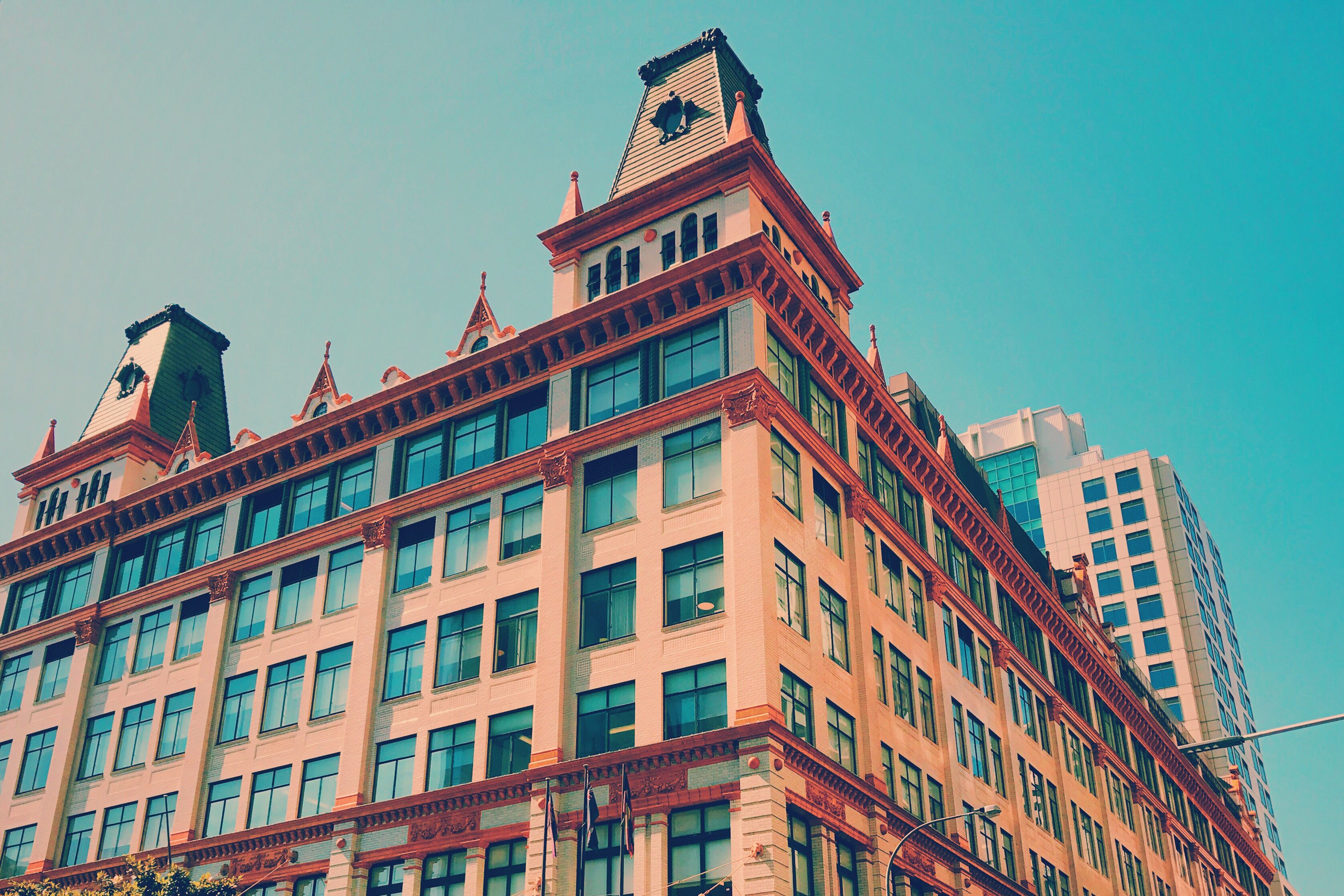 Low Angle View Of Downing Centre Against Blue Sky Low Angle View Of Downing Centre Against Blue Sky